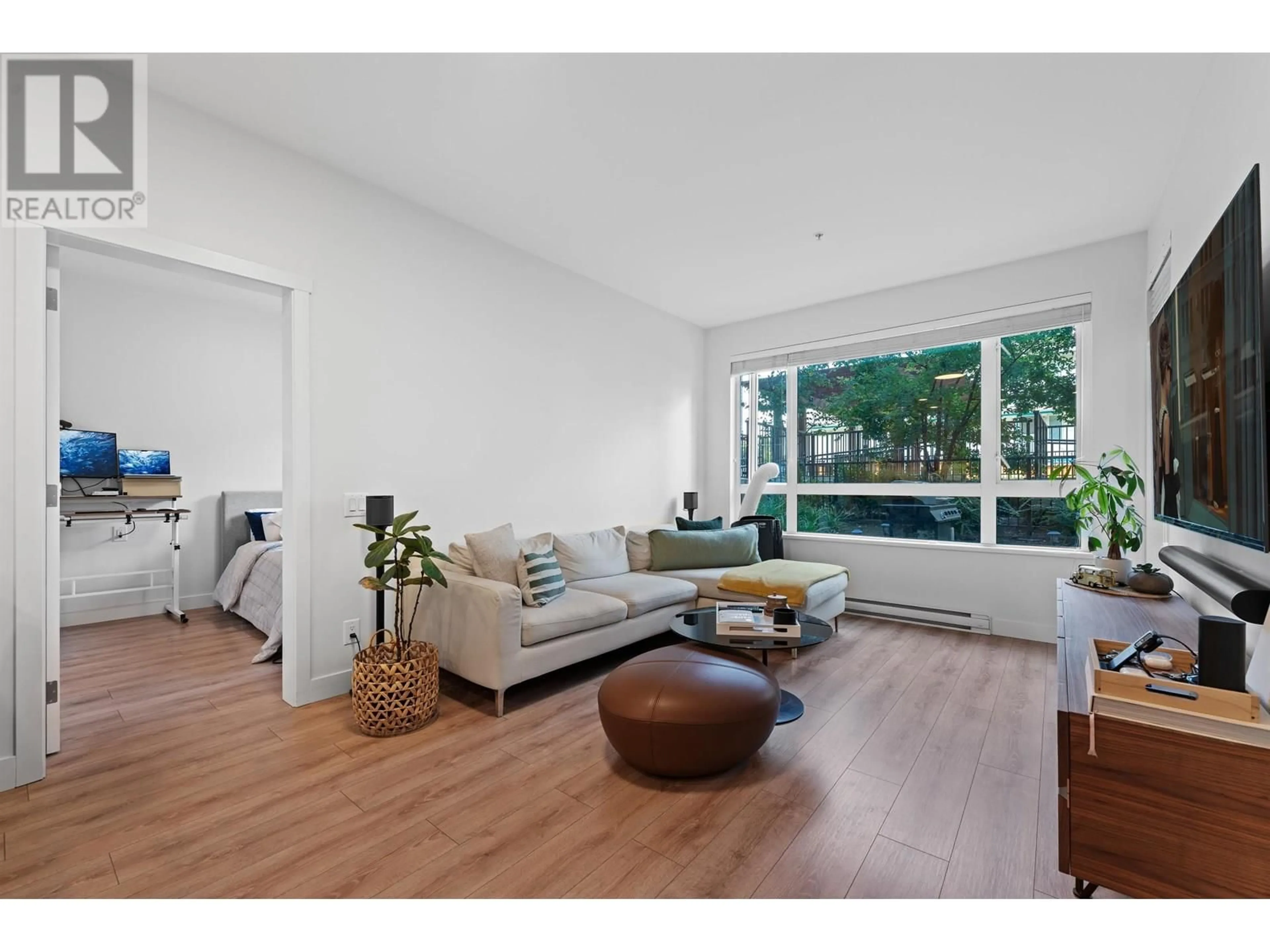 Living room with furniture, wood/laminate floor for 102 - 721 ANSKAR COURT, Coquitlam British Columbia V3J0L4