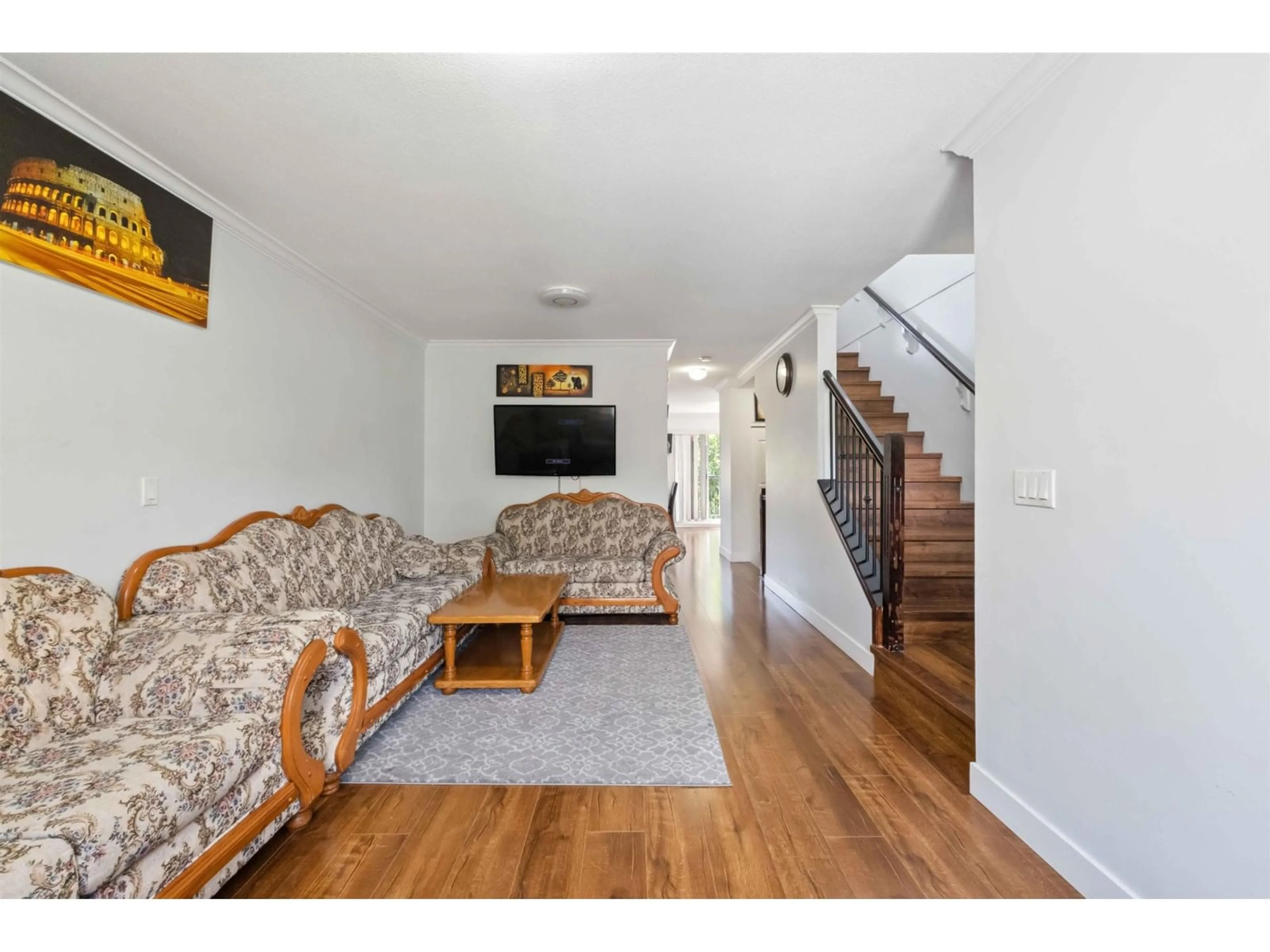 Living room with furniture, wood/laminate floor for 13 - 8255 120A, Surrey British Columbia V3W1T2