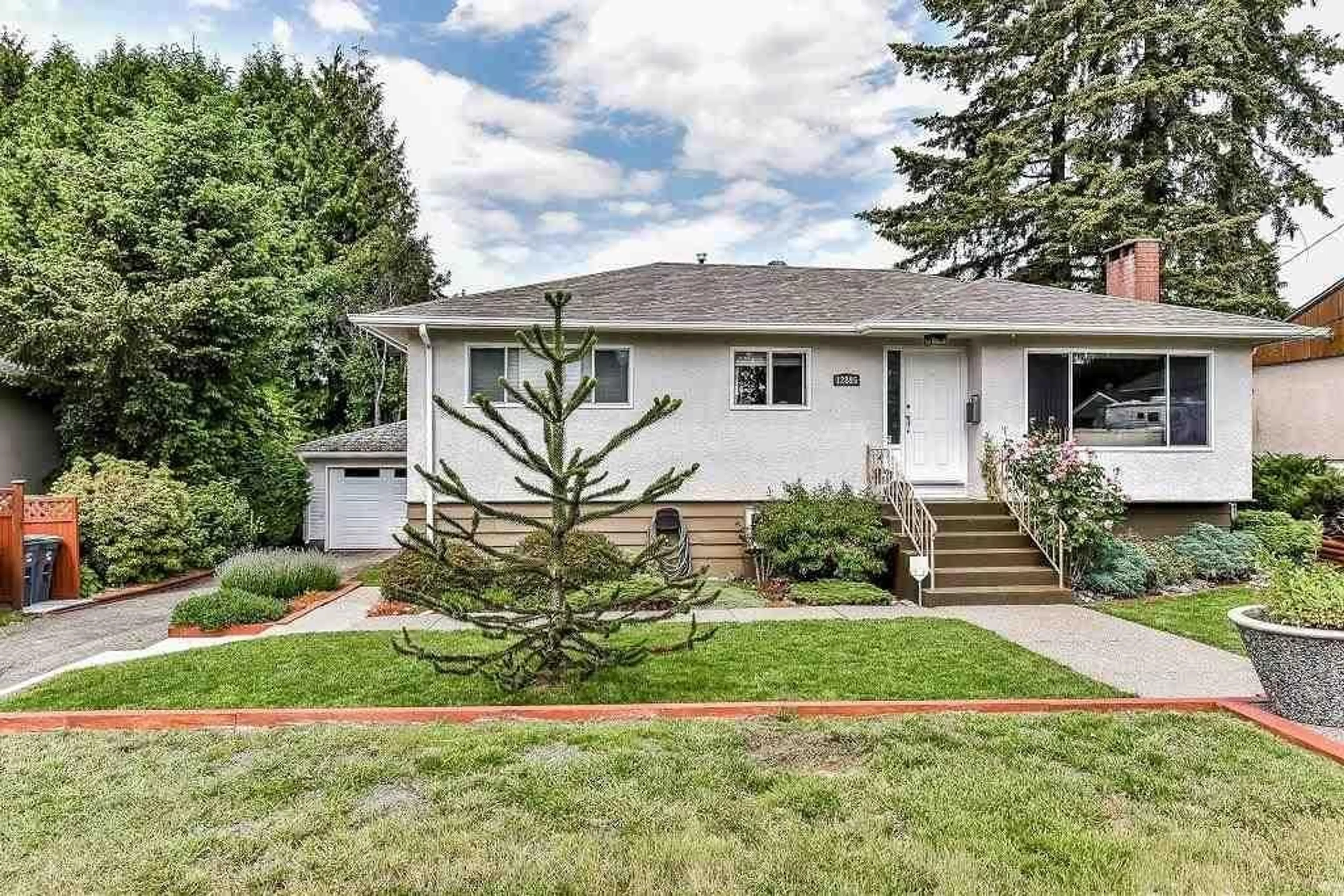 Home with vinyl exterior material, street for 12895 98A, Surrey British Columbia V3T1C3