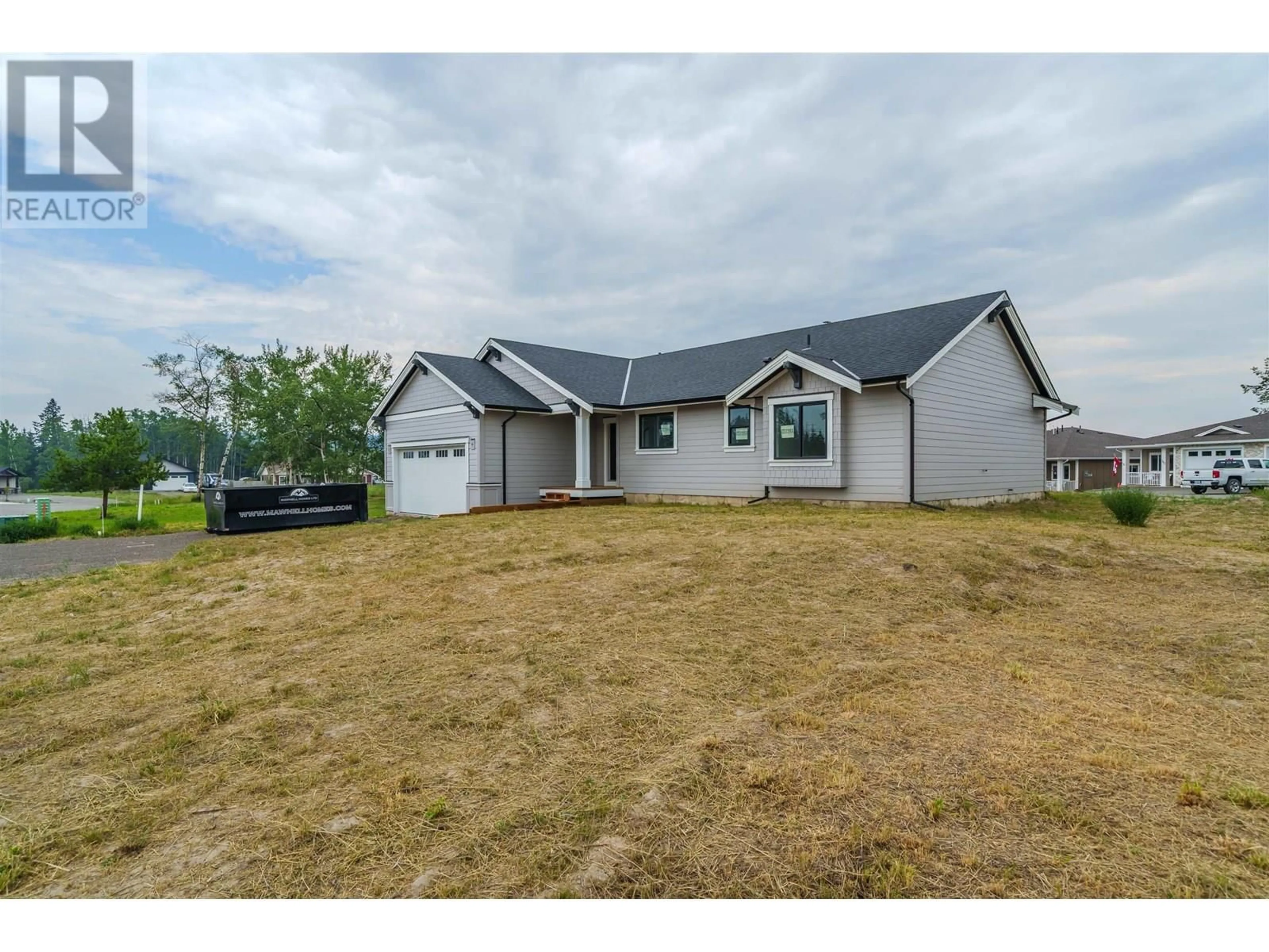 A pic from outside/outdoor area/front of a property/back of a property/a pic from drone, unknown for 345 SANDHILL CRESCENT, 100 Mile House British Columbia V0K2E1