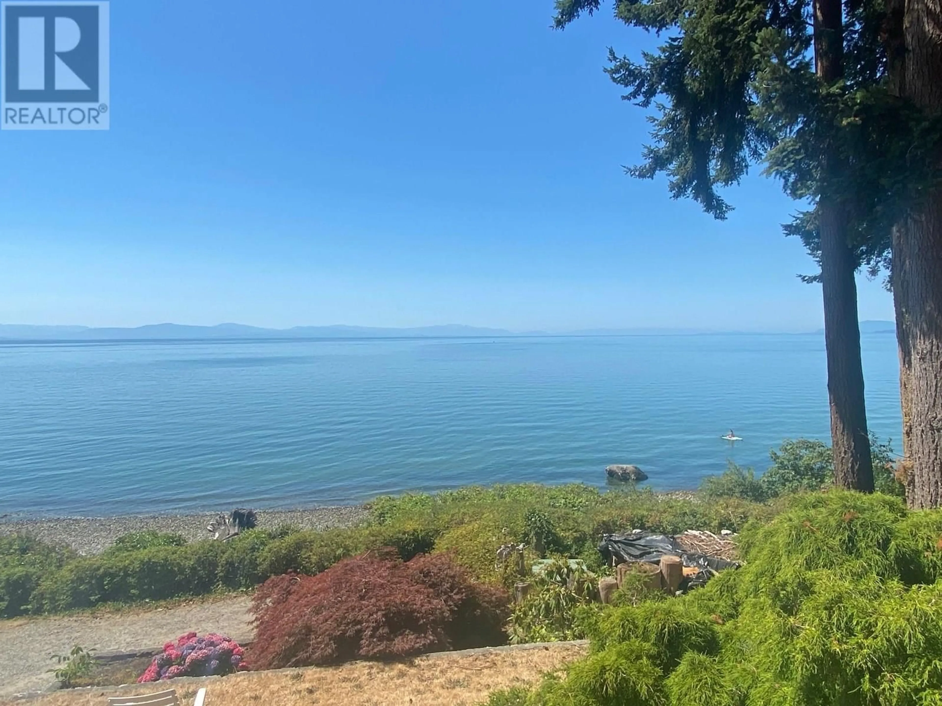 A pic from outside/outdoor area/front of a property/back of a property/a pic from drone, water/lake/river/ocean view for 1714 OCEAN BEACH, Gibsons British Columbia V0N1V5
