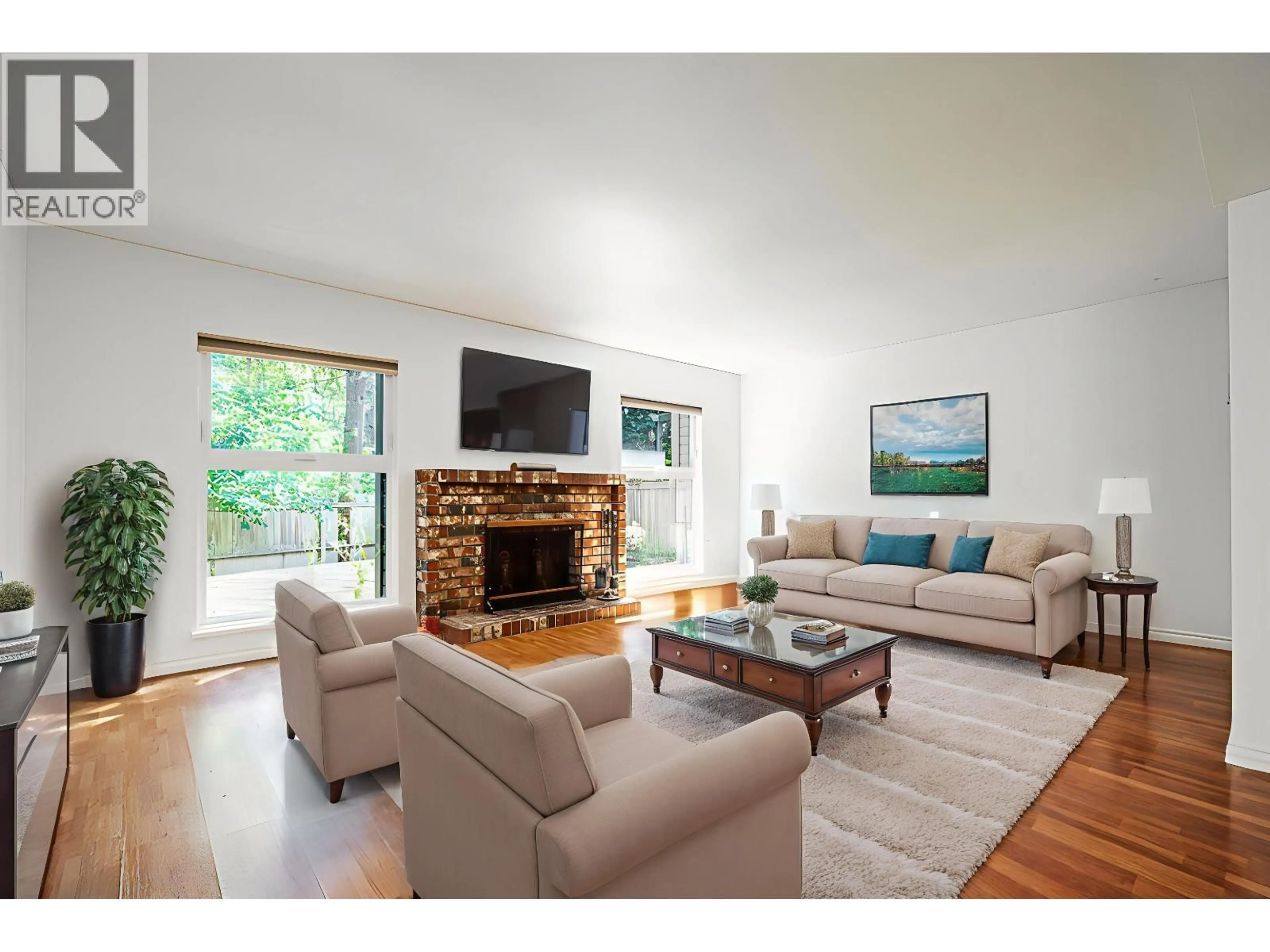 Living room with furniture, wood/laminate floor for 7370 KOKANEE PLACE, Vancouver British Columbia V5S3Y9
