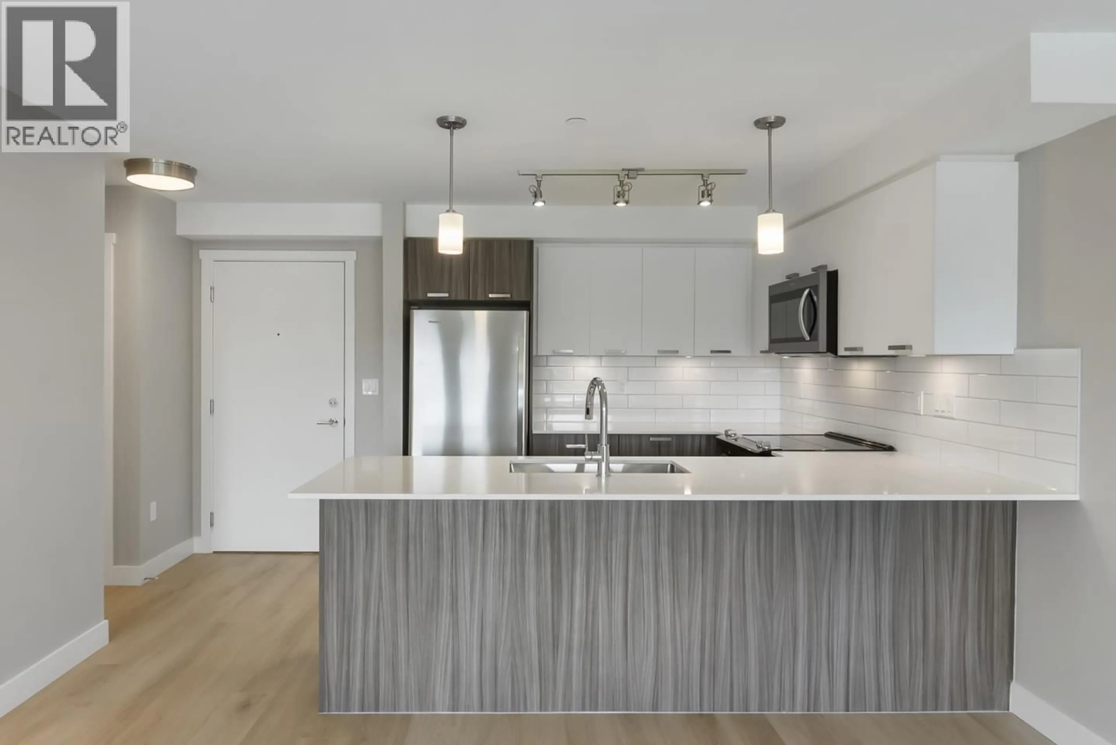 Open concept kitchen, wood/laminate floor for 209 - 22562 121 AVENUE, Maple Ridge British Columbia V2X3Y8
