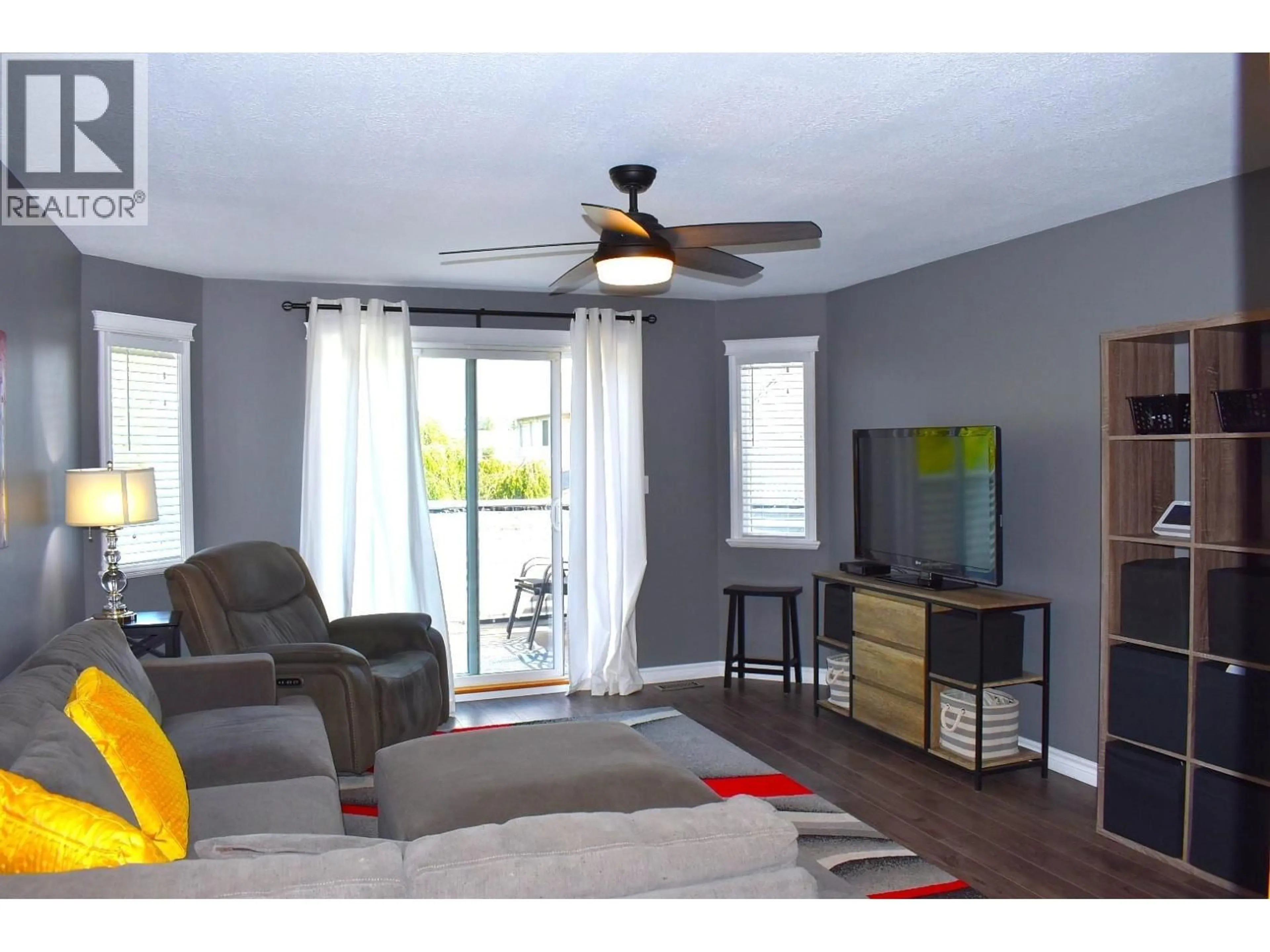 Living room with furniture, wood/laminate floor for 3327 WESTWOOD DRIVE, Prince George British Columbia V2N1S4