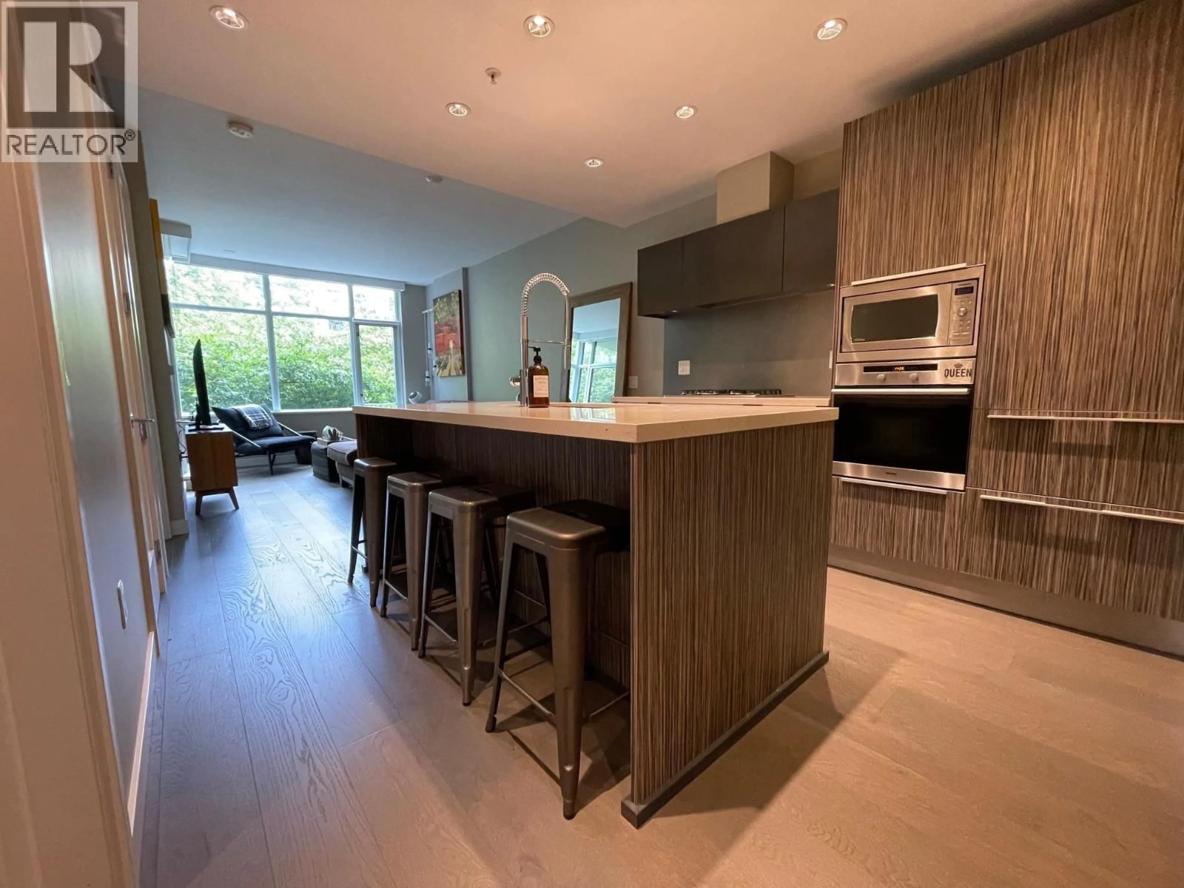 Open concept kitchen, wood/laminate floor for 210 - 181 1ST AVENUE, Vancouver British Columbia V5Y0E3