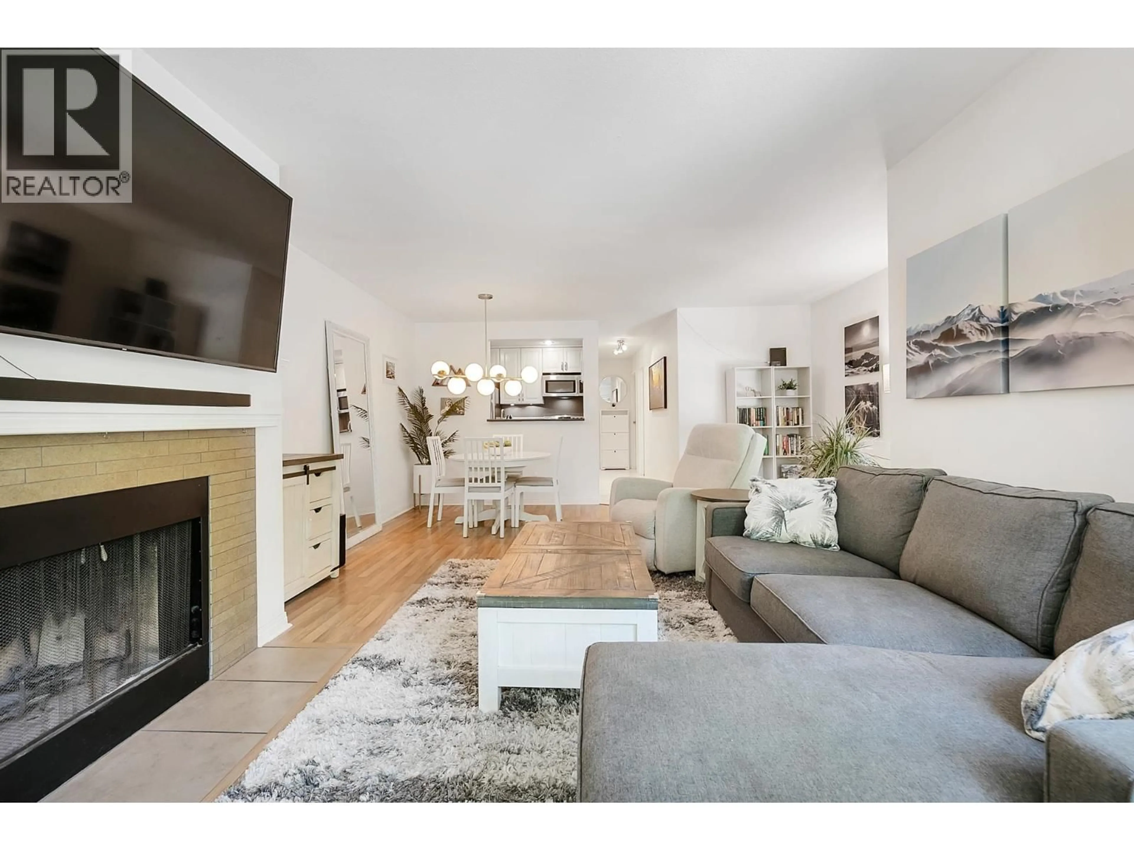 Living room with furniture, wood/laminate floor for 214 - 555 14TH AVENUE, Vancouver British Columbia V5Z4G8
