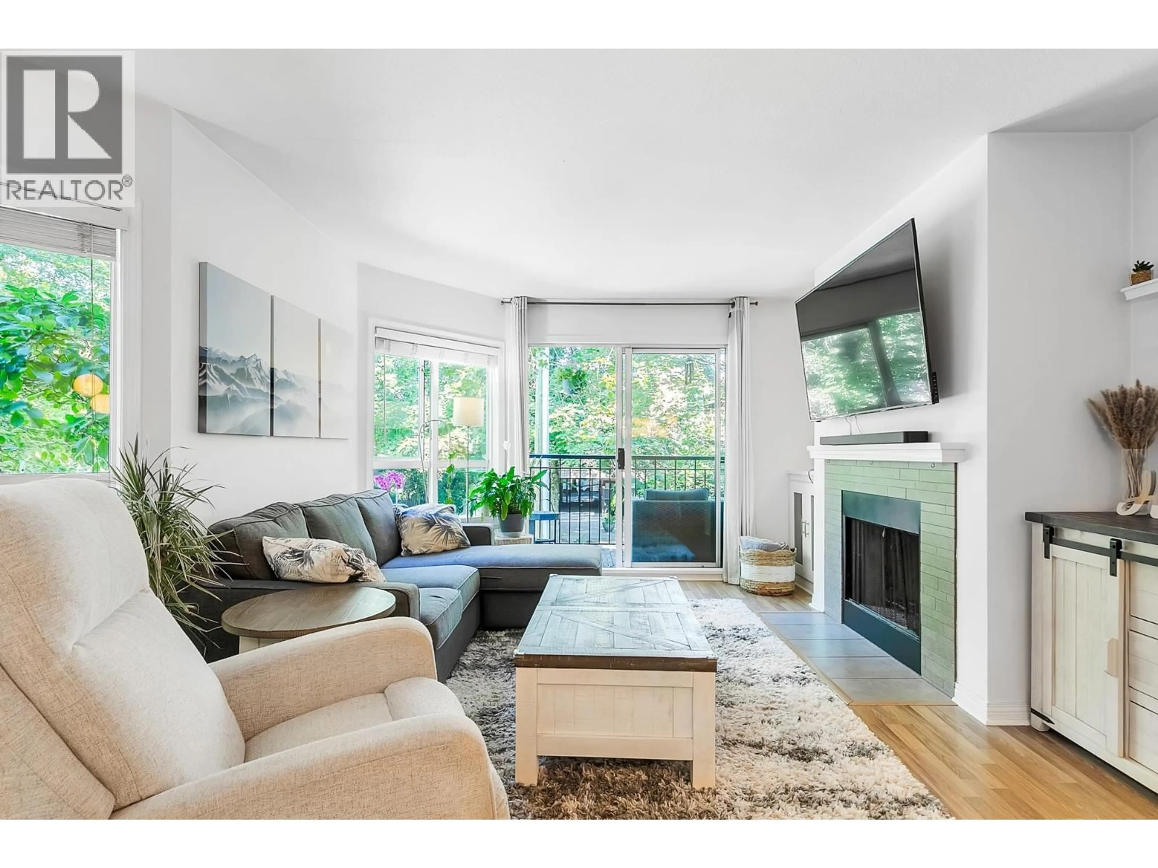 Living room with furniture, wood/laminate floor for 214 - 555 14TH AVENUE, Vancouver British Columbia V5Z4G8