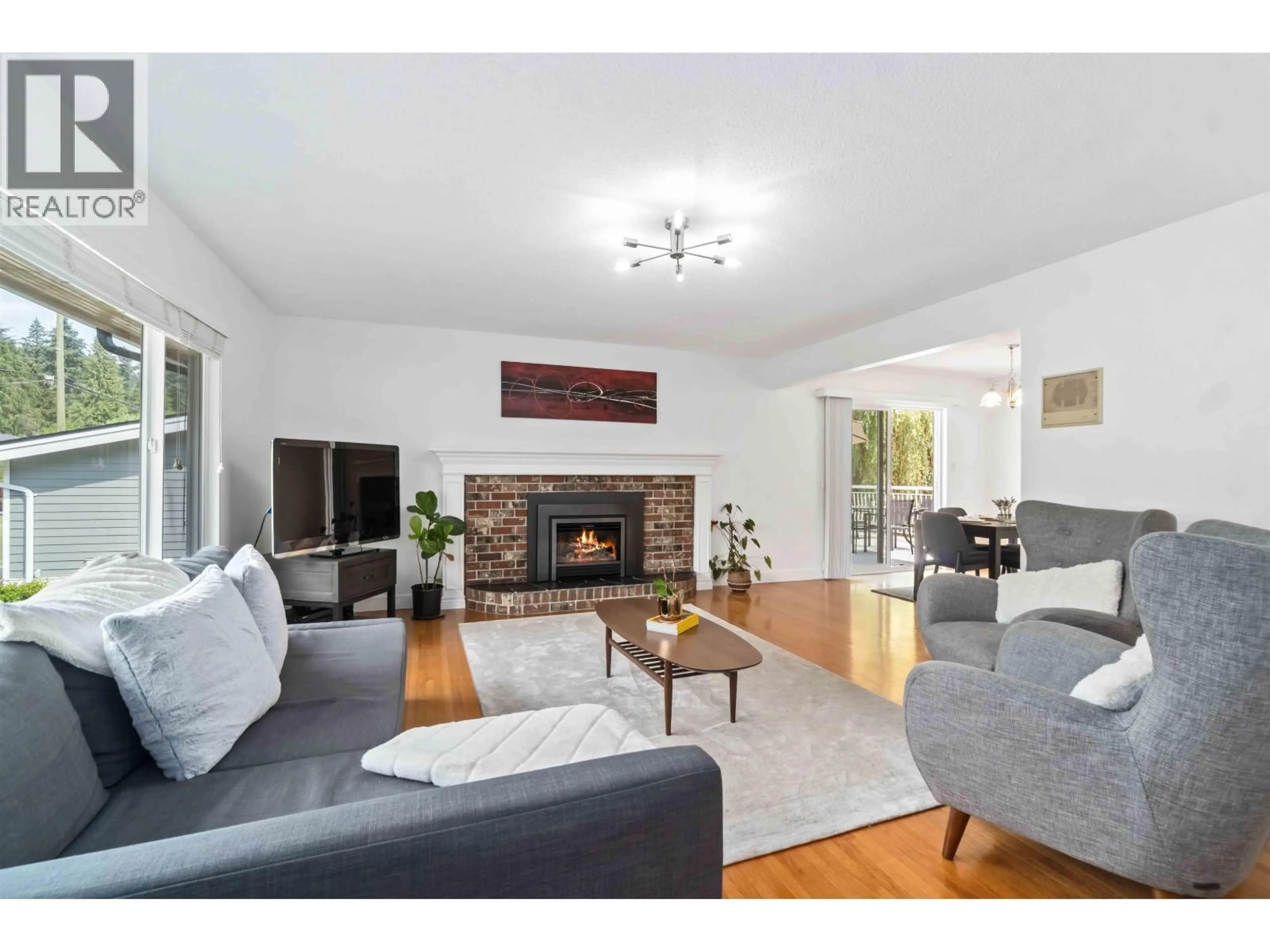 Living room with furniture, wood/laminate floor for 2681 STANDISH DRIVE, North Vancouver British Columbia V7H1M9