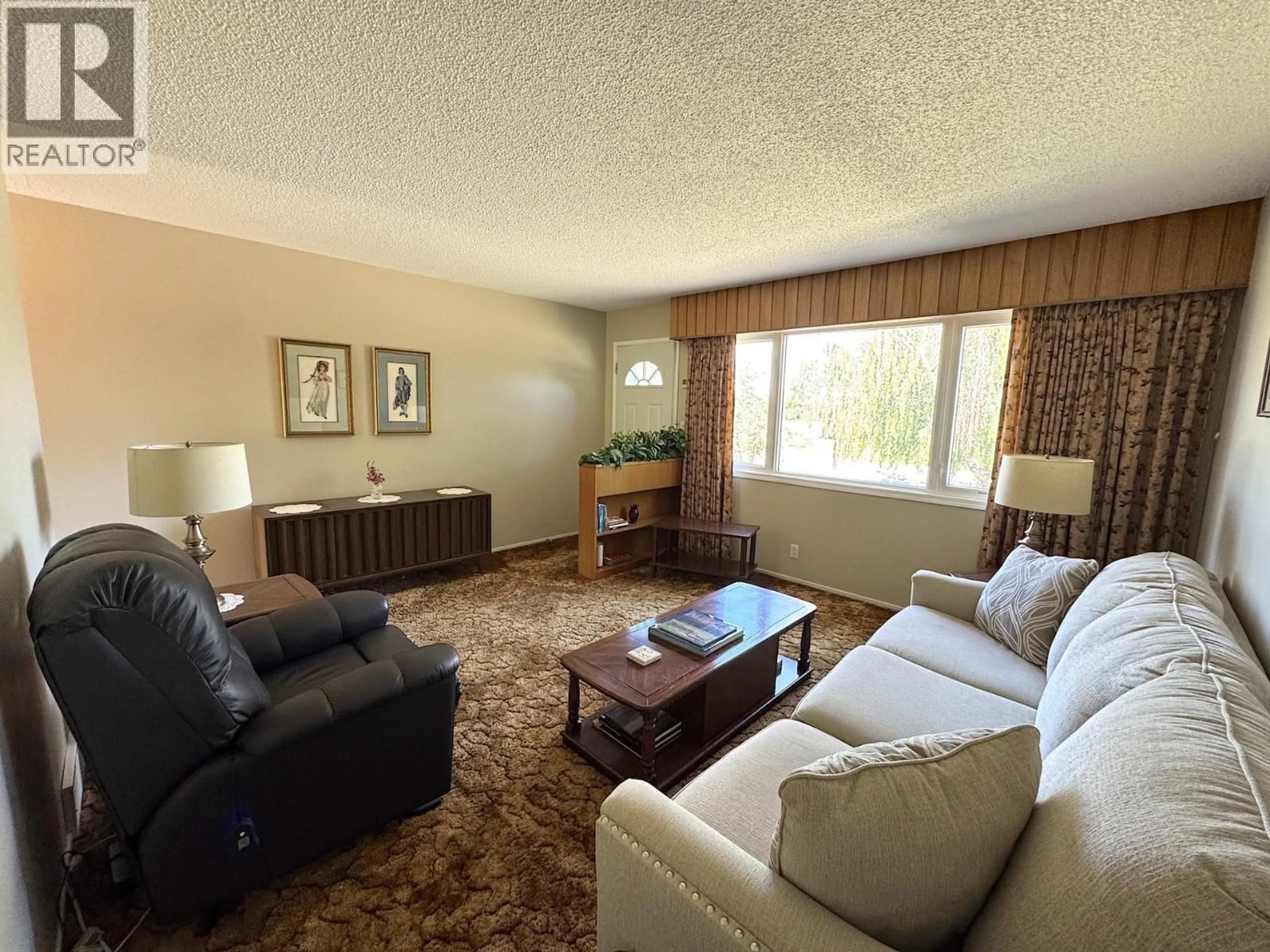 Living room with furniture, carpet floor for 9703 112 AVENUE, Fort St. John British Columbia V1J2W1