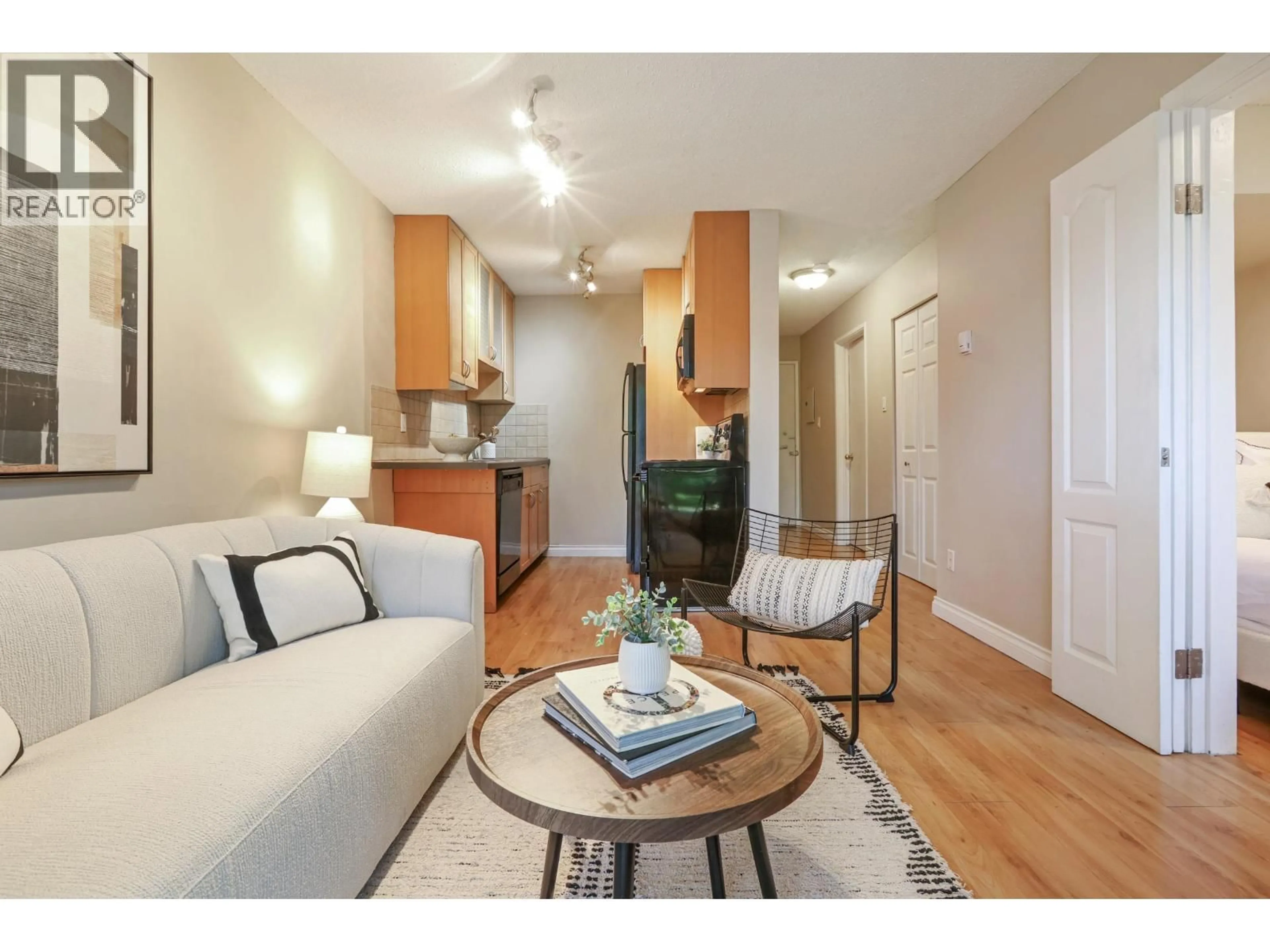 Living room with furniture, wood/laminate floor for 106 - 2125 2ND AVENUE, Vancouver British Columbia V6K1H7
