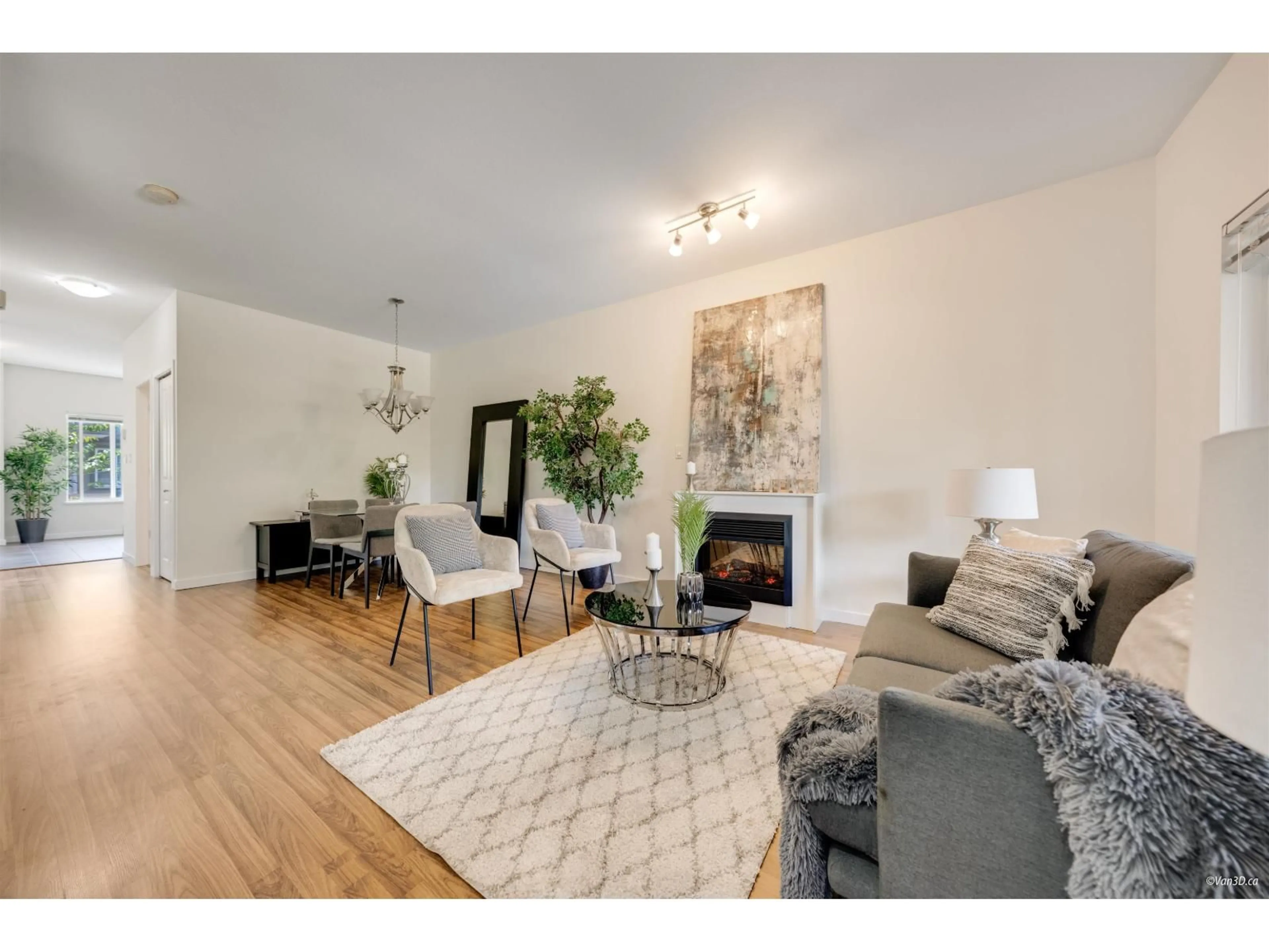 Living room with furniture, wood/laminate floor for 15 - 18701 66, Surrey British Columbia V3S4P3