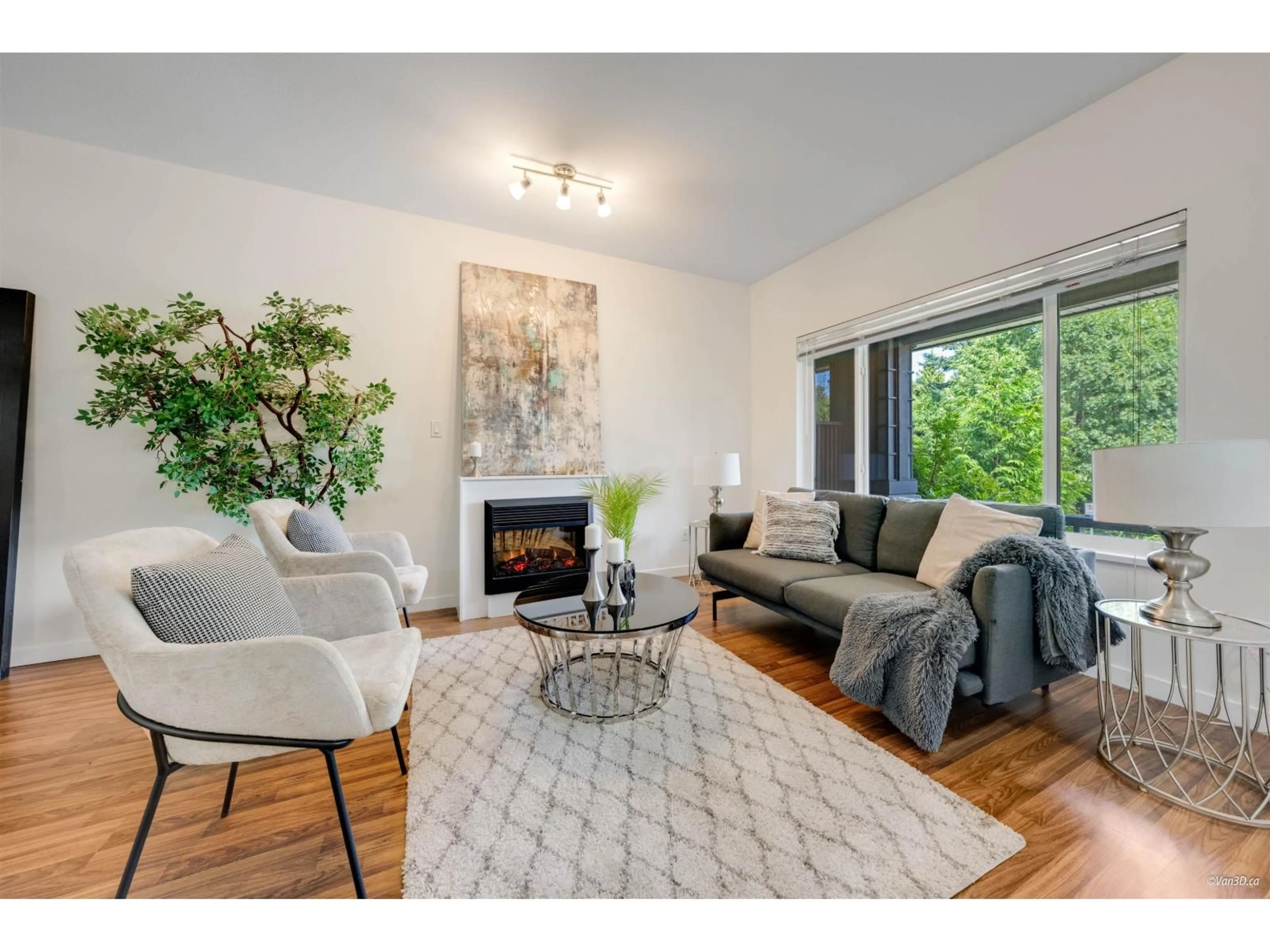 Living room with furniture, wood/laminate floor for 15 - 18701 66, Surrey British Columbia V3S4P3