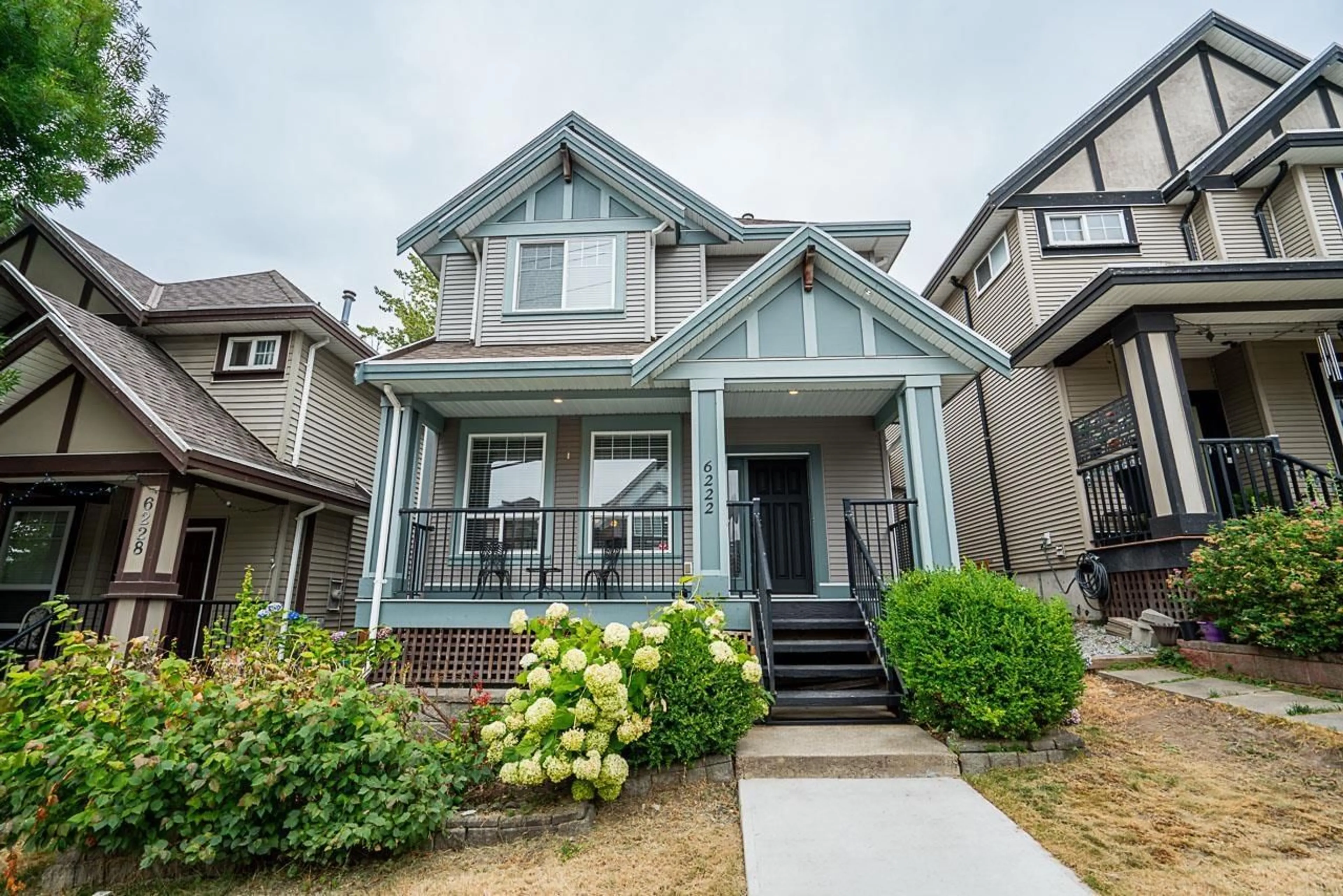 Home with vinyl exterior material, street for 6222 148TH, Surrey British Columbia V3S8E8