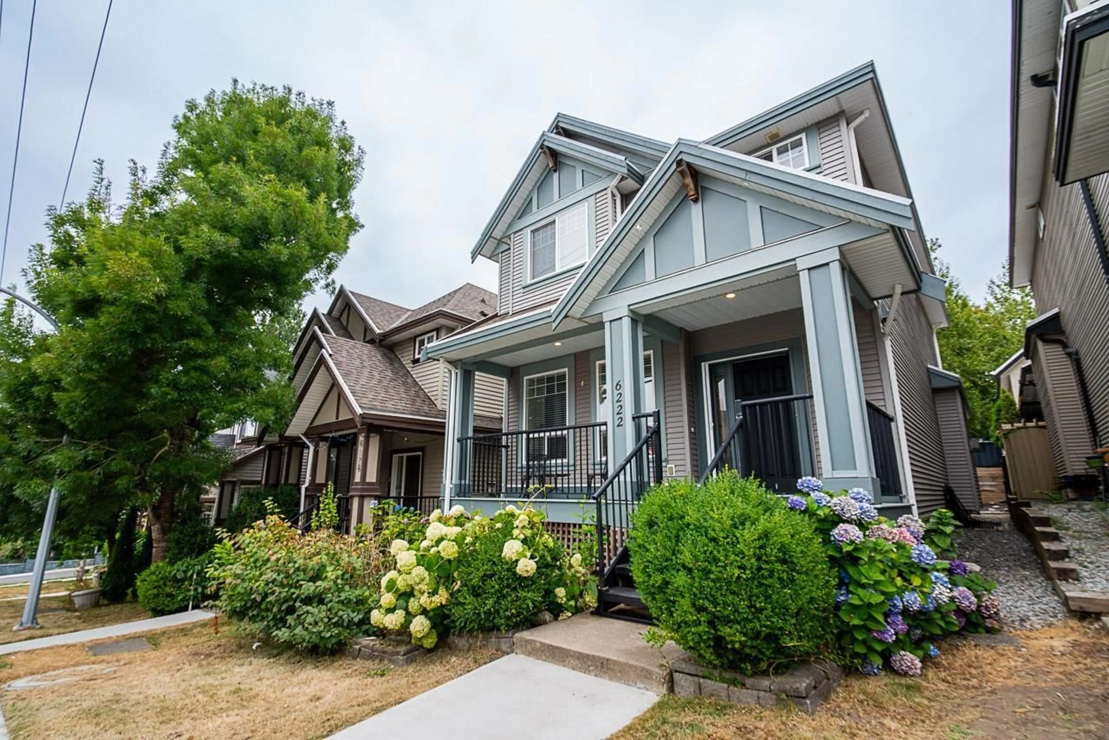 Home with vinyl exterior material, street for 6222 148TH, Surrey British Columbia V3S8E8