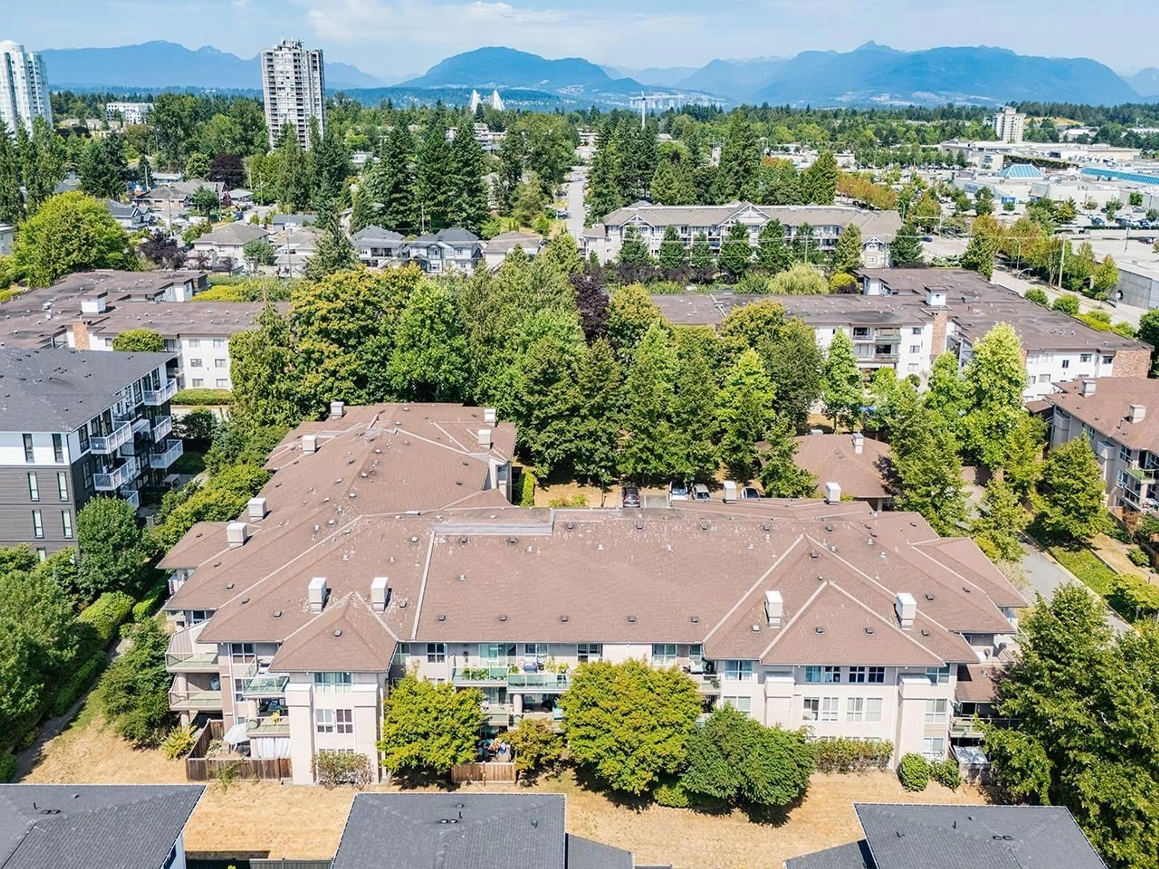 A pic from outside/outdoor area/front of a property/back of a property/a pic from drone, mountain view for 108 - 14981 101A, Surrey British Columbia V3R0T1