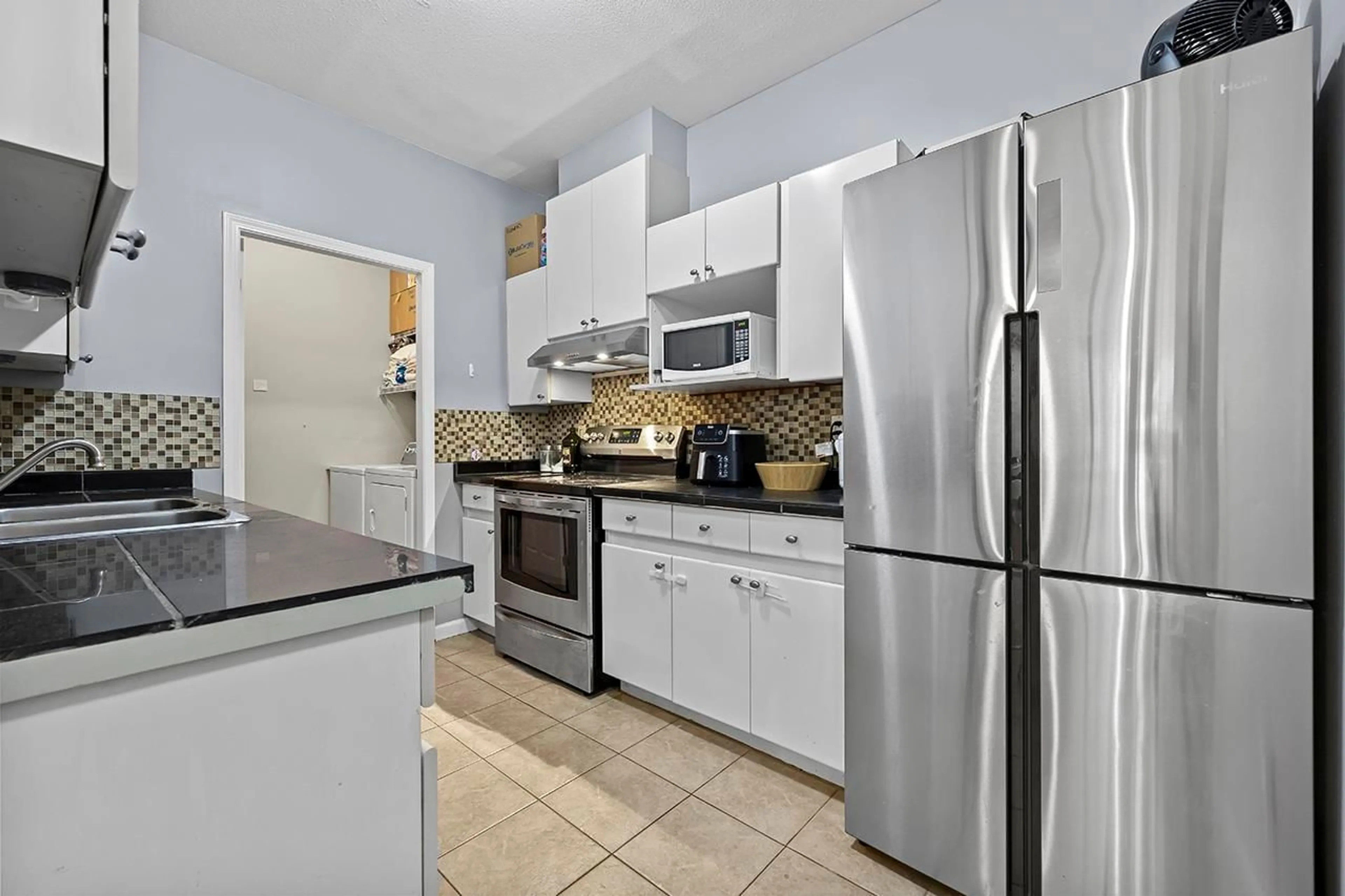 Standard kitchen, ceramic/tile floor for 108 - 14981 101A, Surrey British Columbia V3R0T1