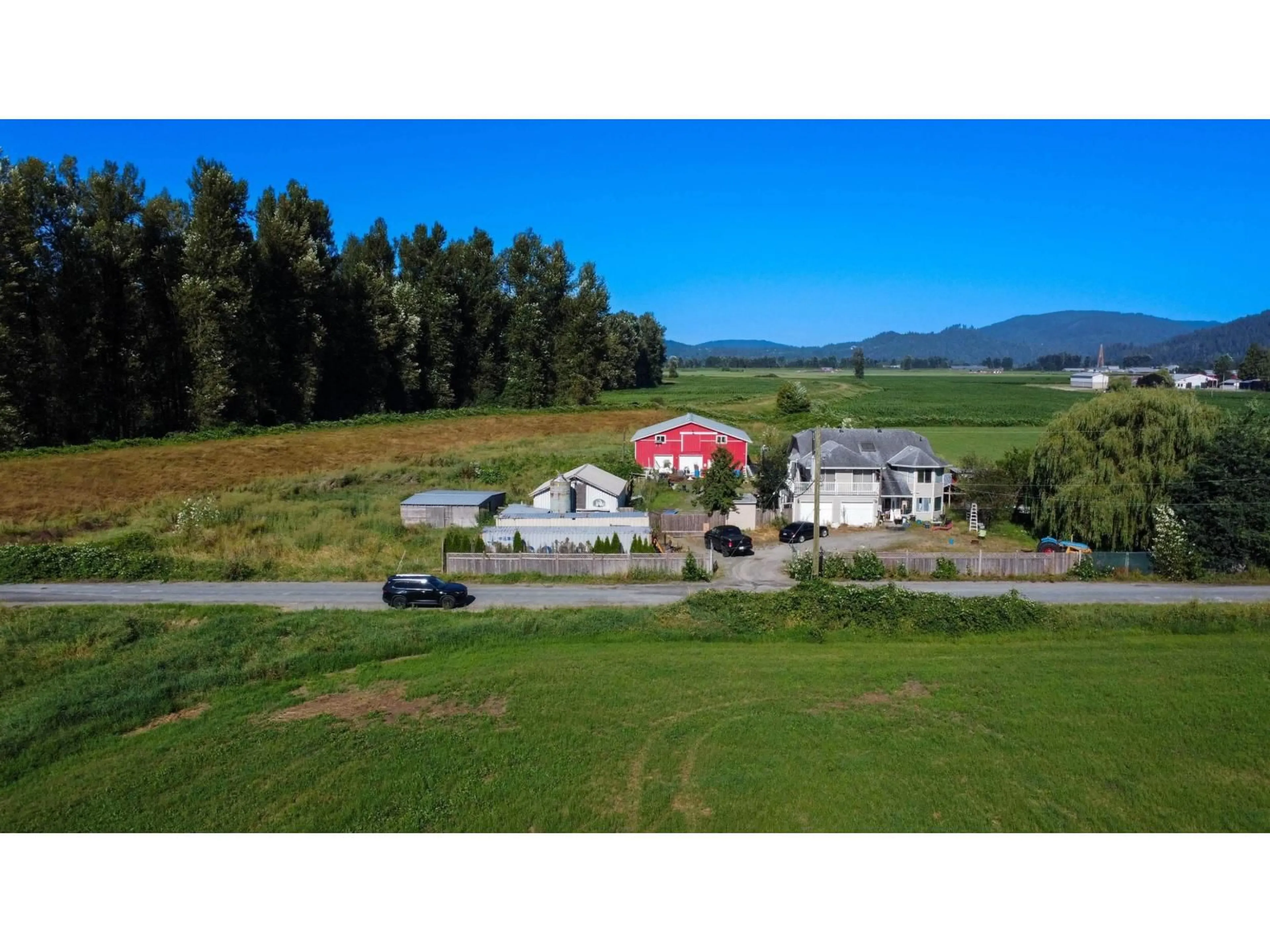 A pic from outside/outdoor area/front of a property/back of a property/a pic from drone, mountain view for 8309 THOMPSON, Mission British Columbia V0M1G0