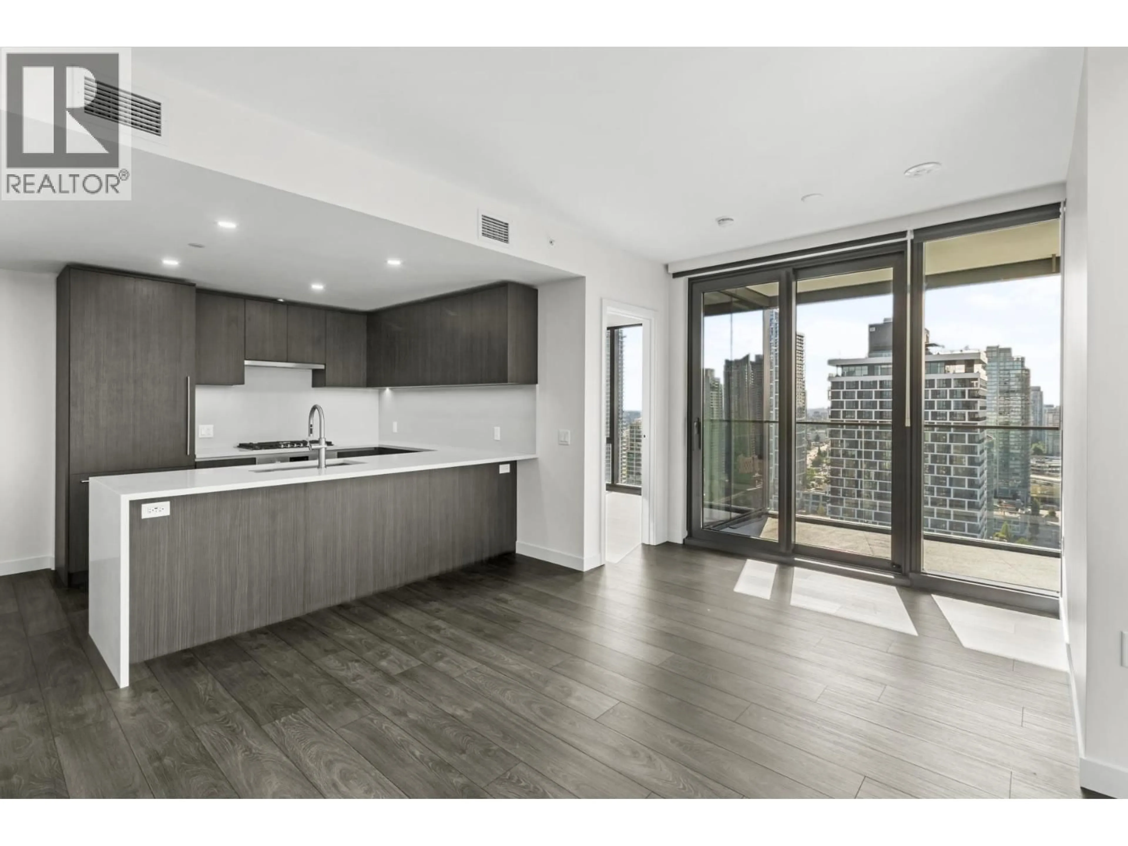 Open concept kitchen, wood/laminate floor for 2502 - 5987 WILSON AVENUE, Burnaby British Columbia V5H0L7
