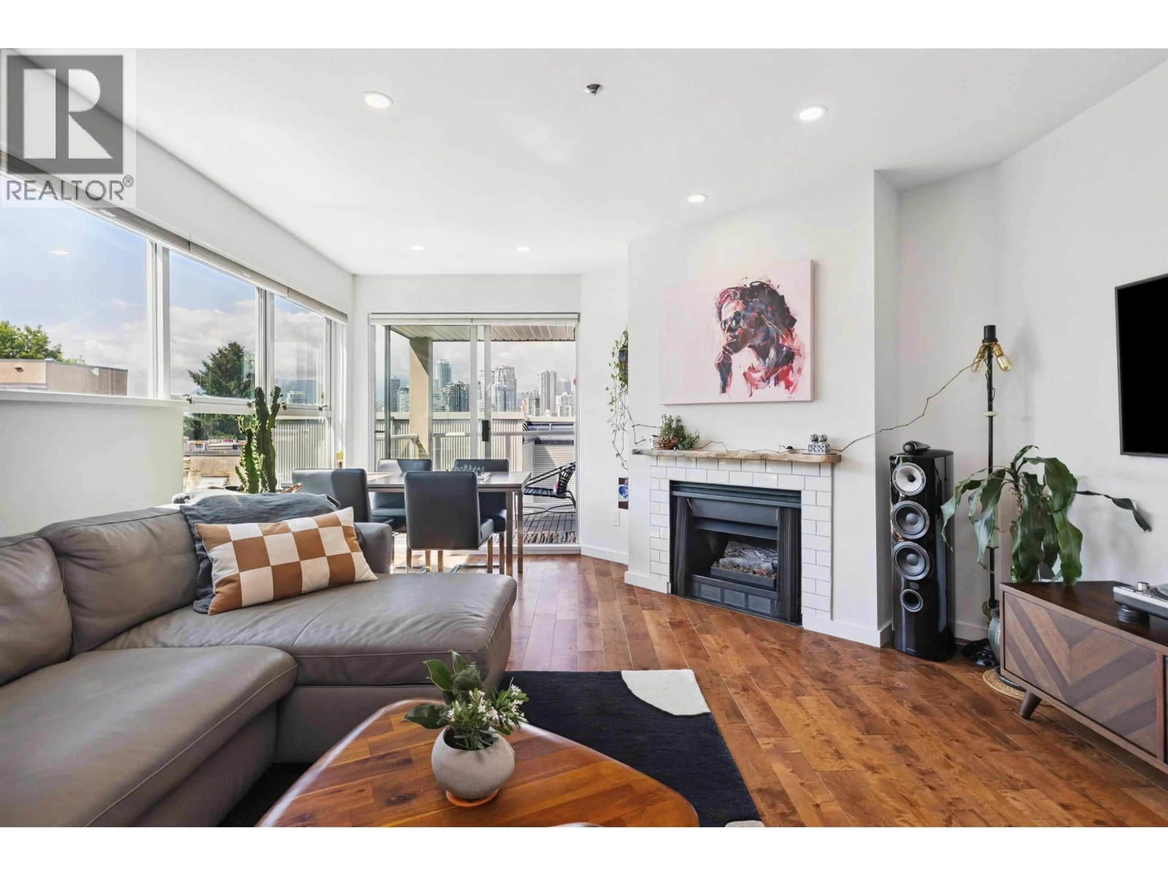 Living room with furniture, wood/laminate floor for 105 - 953 8TH AVENUE, Vancouver British Columbia V5Z1E4