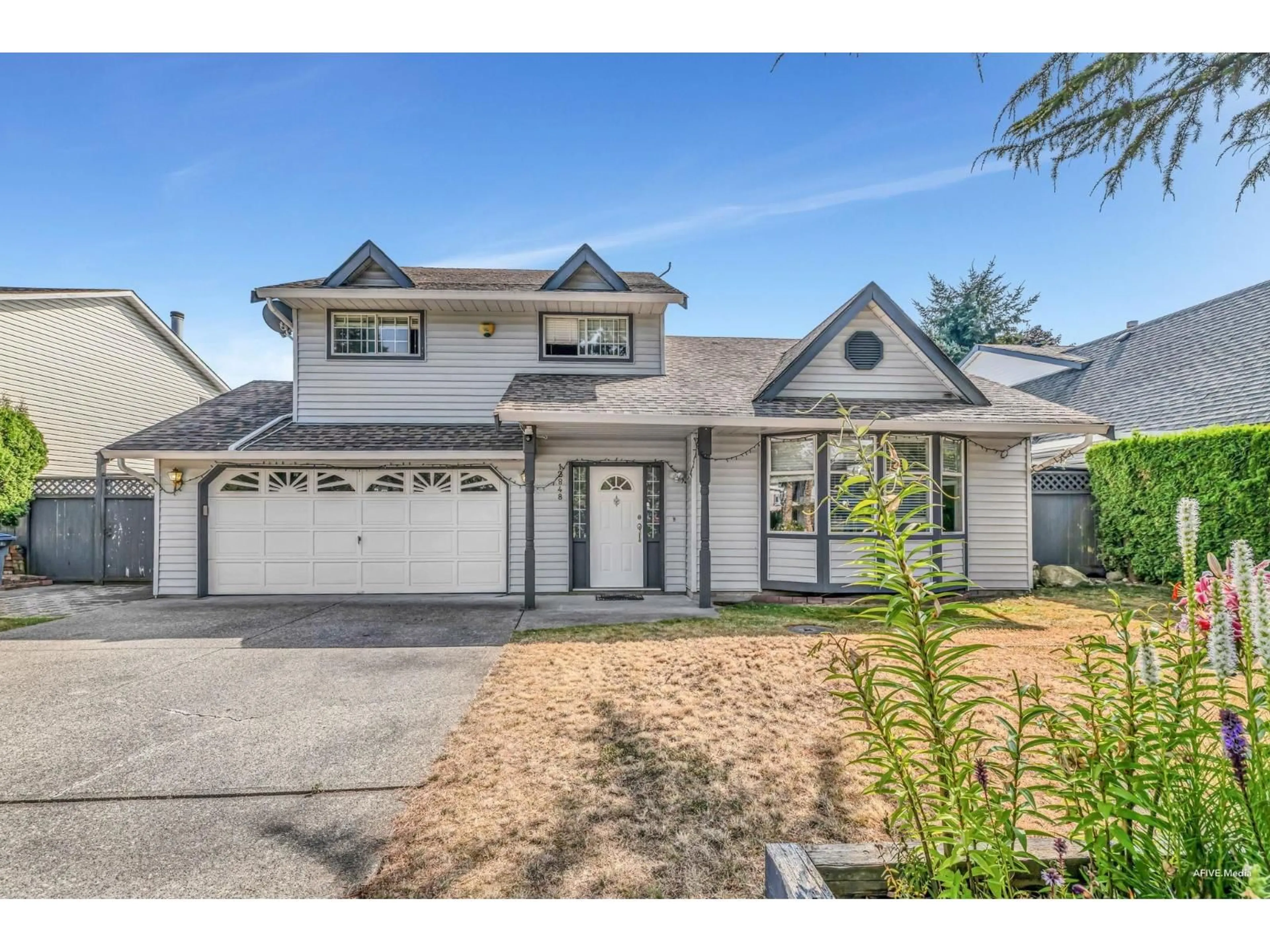 Home with vinyl exterior material, street for 12848 65, Surrey British Columbia V3W9P4