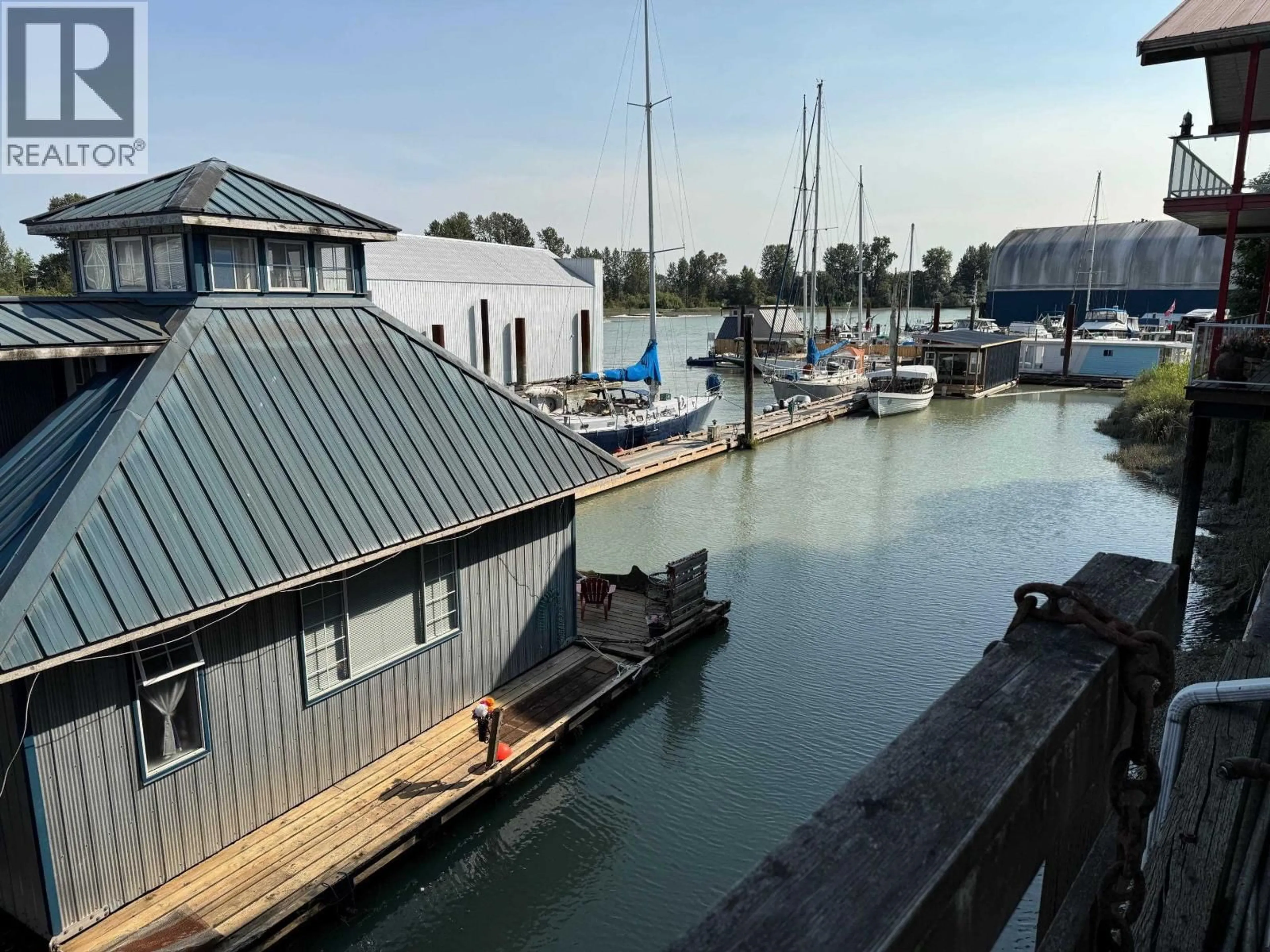 A pic from outside/outdoor area/front of a property/back of a property/a pic from drone, water/lake/river/ocean view for 23220 DYKE ROAD, Richmond British Columbia V6V1E2