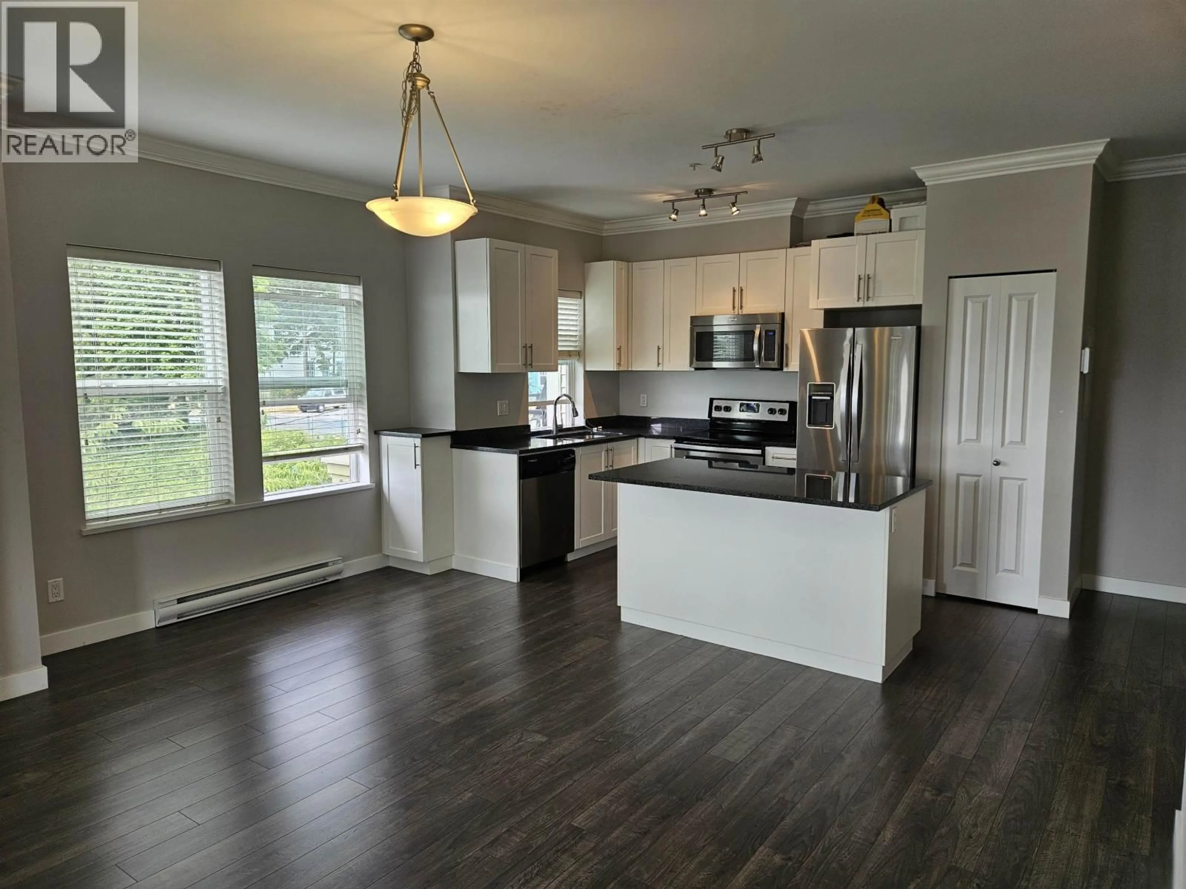 Open concept kitchen, wood/laminate floor for 312 - 11580 223 STREET, Maple Ridge British Columbia V2X9H1