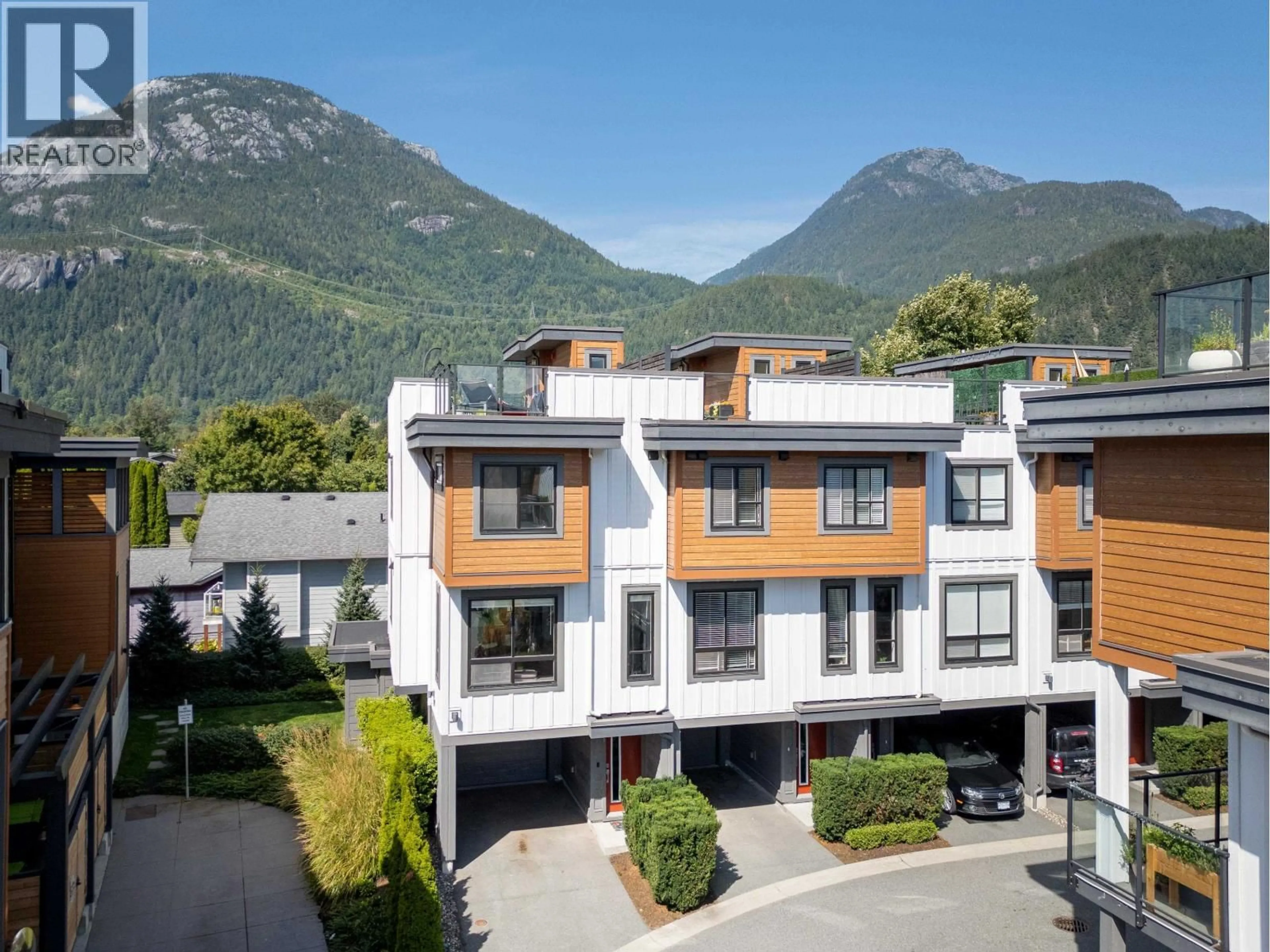A pic from outside/outdoor area/front of a property/back of a property/a pic from drone, mountain view for 1 - 39769 GOVERNMENT ROAD, Squamish British Columbia V8B0Z1