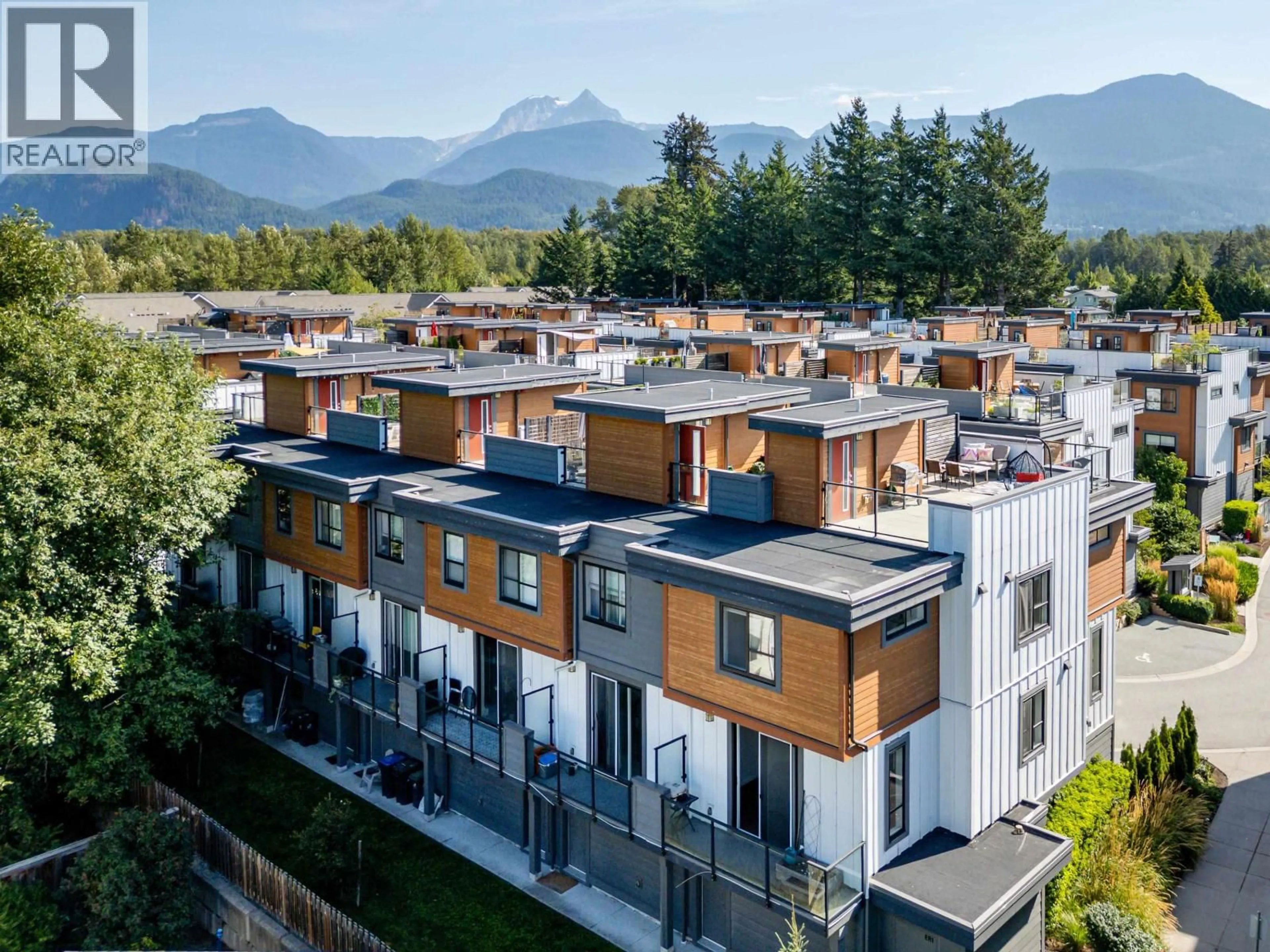 A pic from outside/outdoor area/front of a property/back of a property/a pic from drone, mountain view for 1 - 39769 GOVERNMENT ROAD, Squamish British Columbia V8B0Z1
