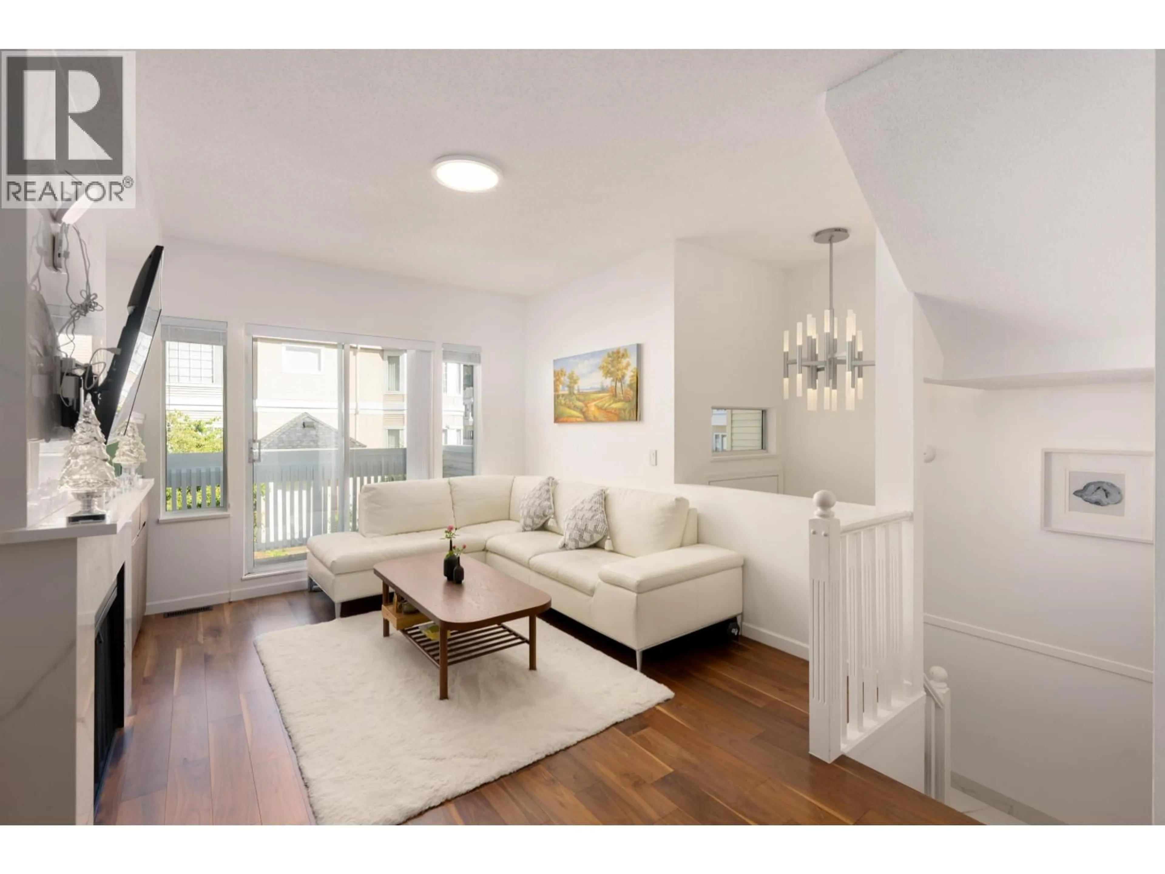 Living room with furniture, wood/laminate floor for 24 - 6700 RUMBLE STREET, Burnaby British Columbia V5E4H7