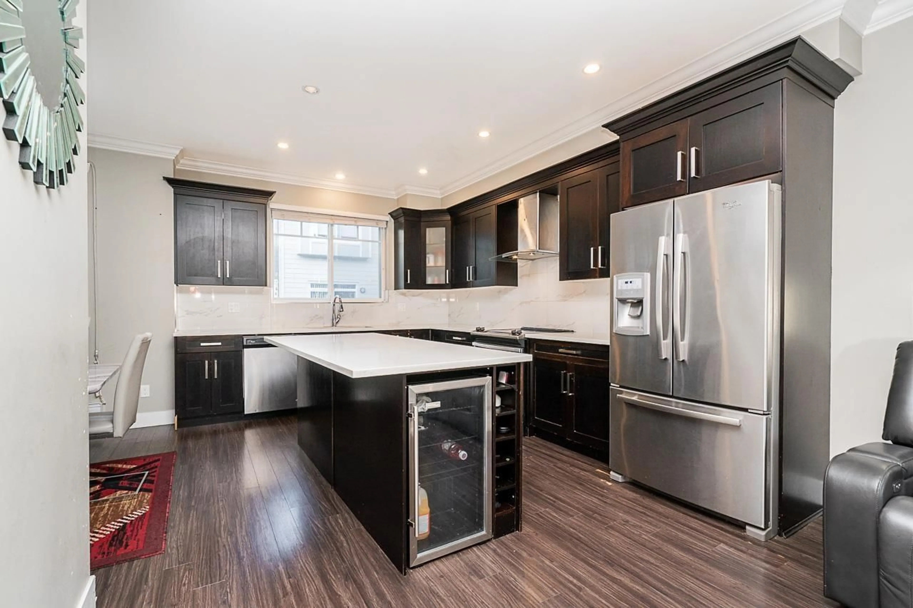 Open concept kitchen, wood/laminate floor for 4 - 14285 64, Surrey British Columbia V3W1Z2