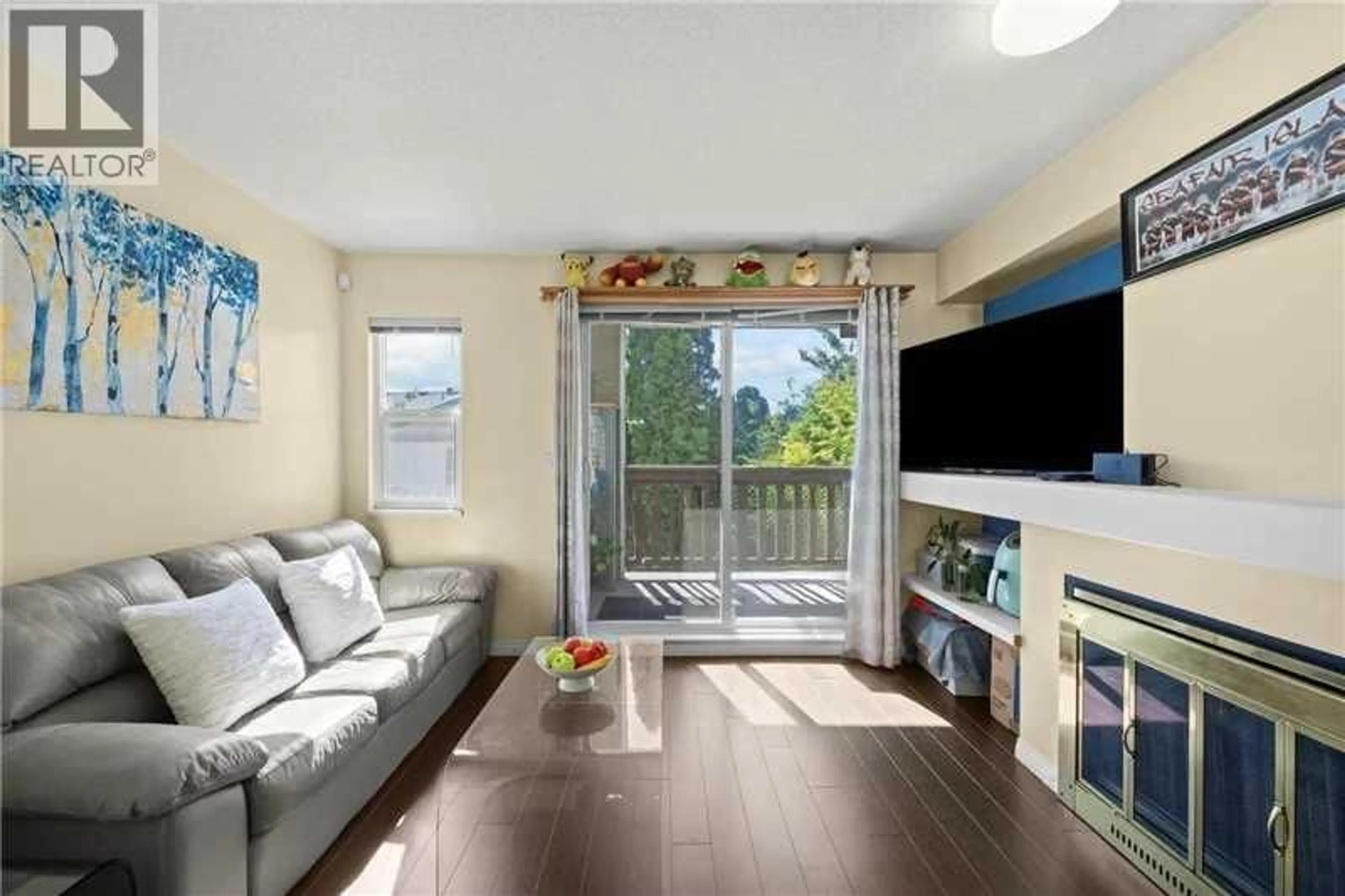 Living room with furniture, wood/laminate floor for 3 - 7111 LYNNWOOD DRIVE, Richmond British Columbia V7C5S9