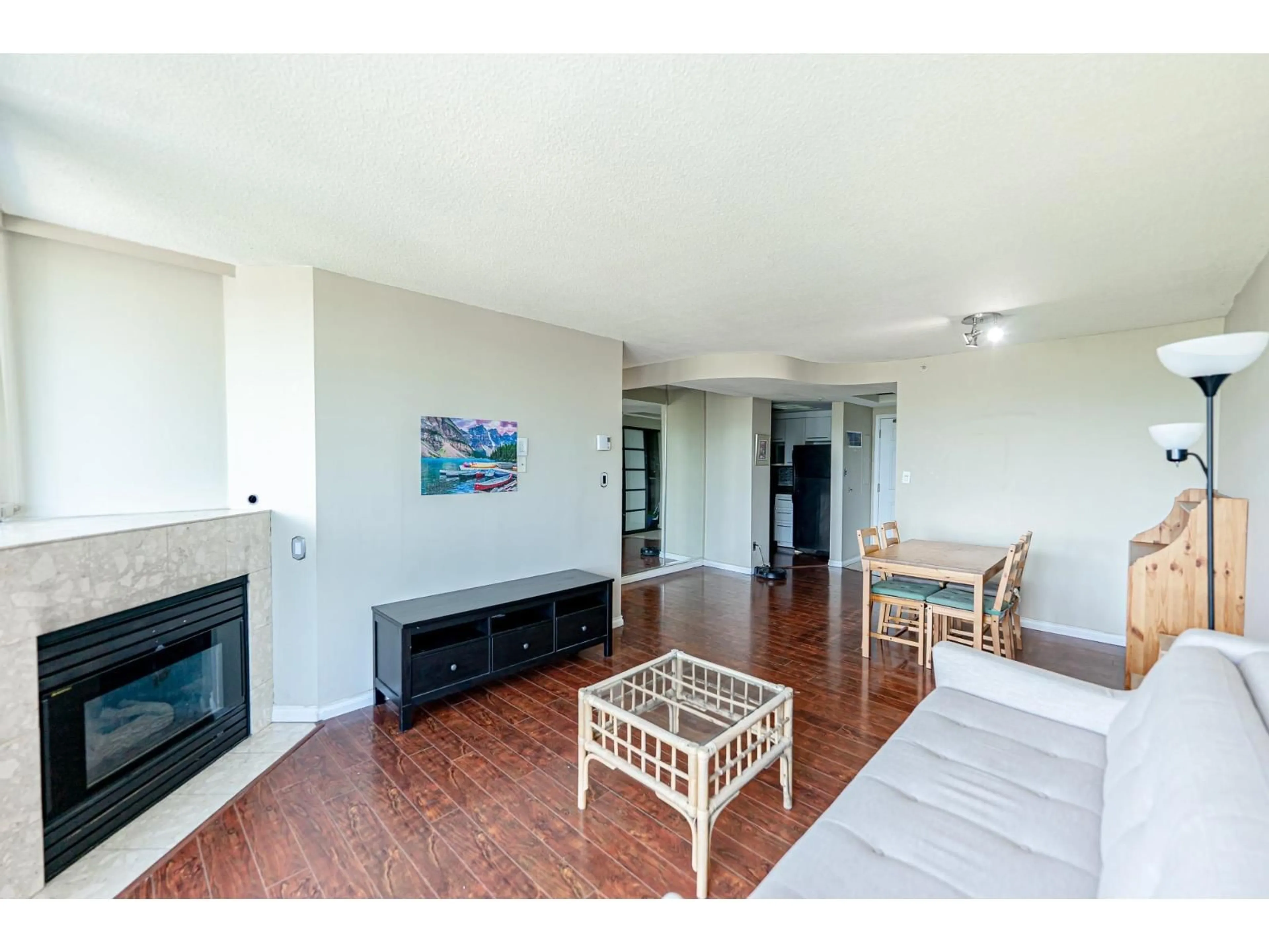 Living room with furniture, wood/laminate floor for 806 - 13353 108, Surrey British Columbia V3T5T5