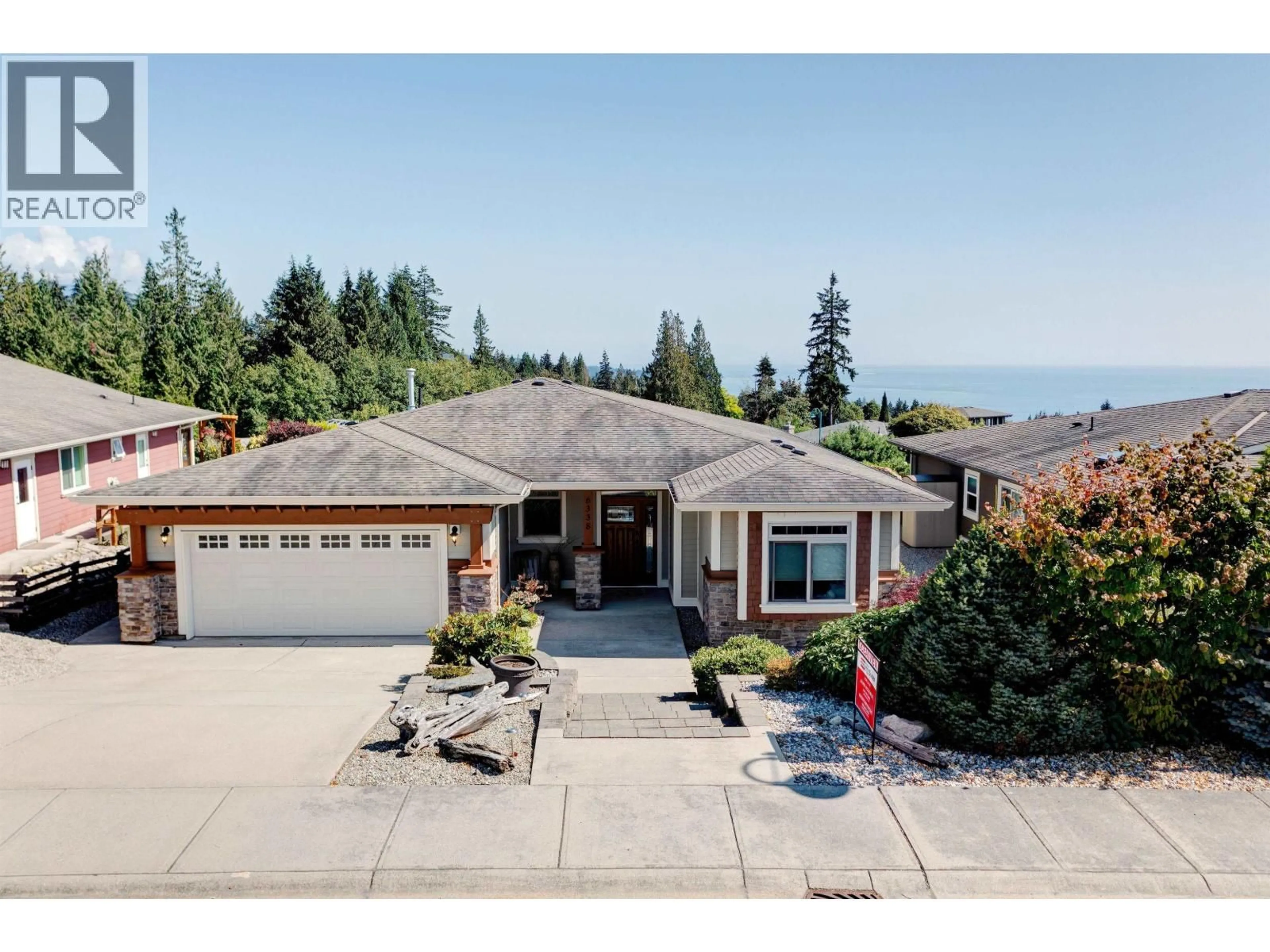 A pic from outside/outdoor area/front of a property/back of a property/a pic from drone, water/lake/river/ocean view for 6338 BAILLIE ROAD, Sechelt British Columbia V7Z0N7