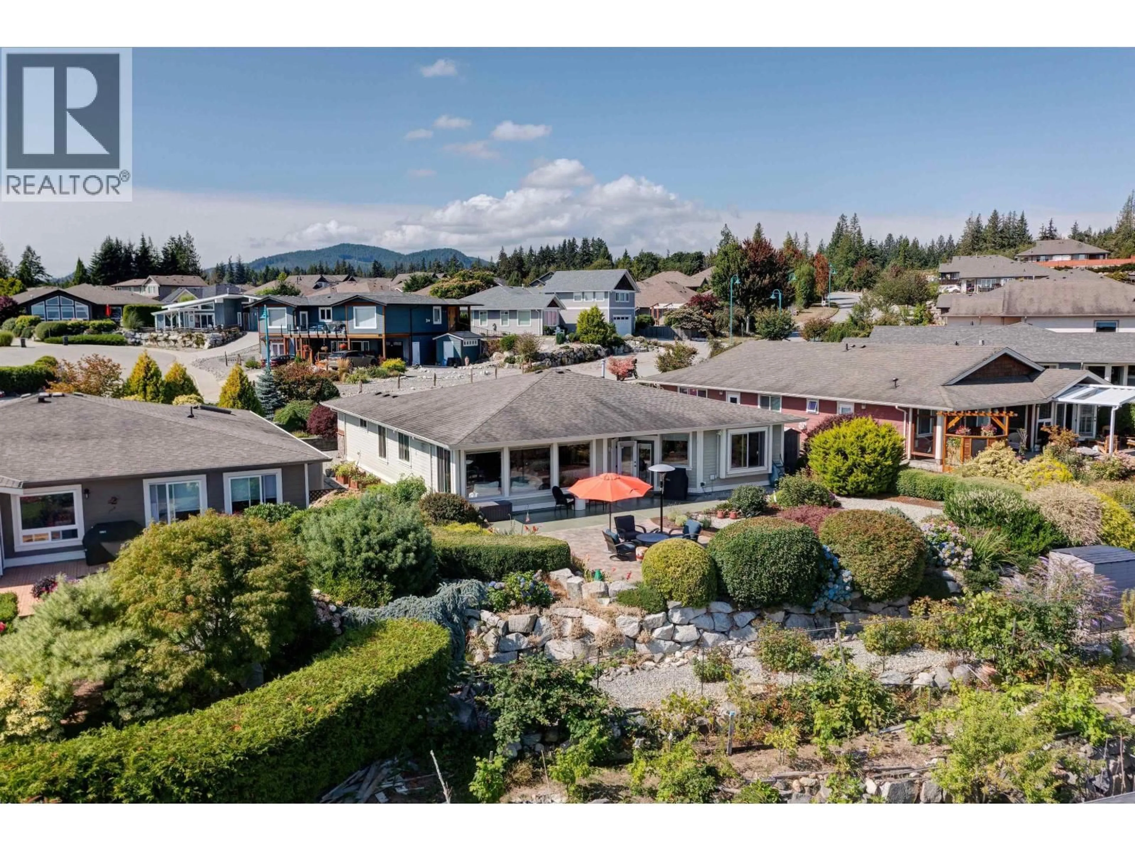 A pic from outside/outdoor area/front of a property/back of a property/a pic from drone, mountain view for 6338 BAILLIE ROAD, Sechelt British Columbia V7Z0N7