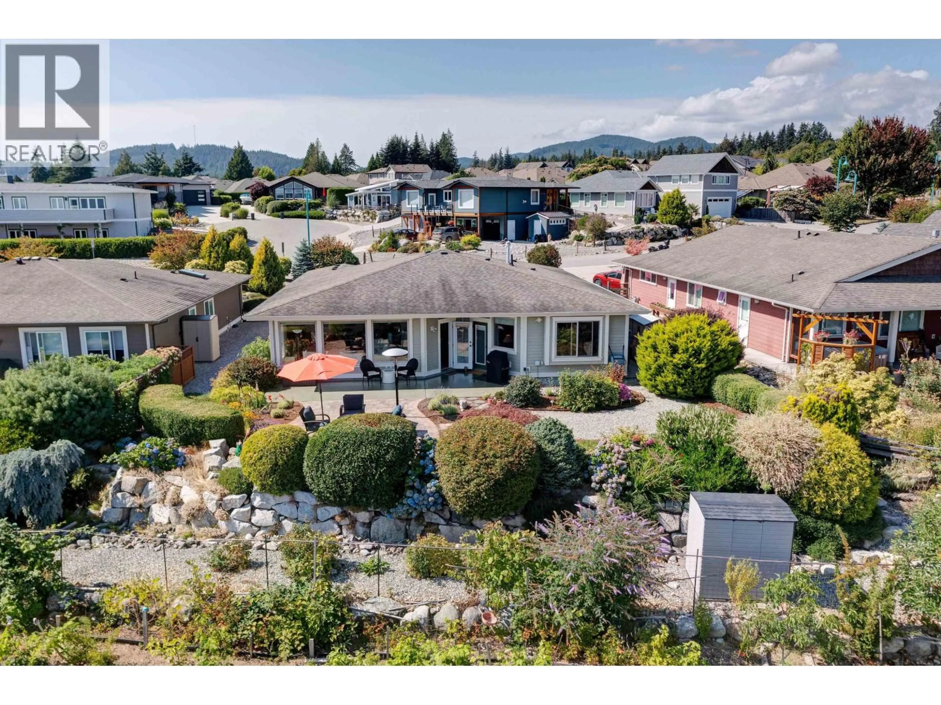 A pic from outside/outdoor area/front of a property/back of a property/a pic from drone, water/lake/river/ocean view for 6338 BAILLIE ROAD, Sechelt British Columbia V7Z0N7