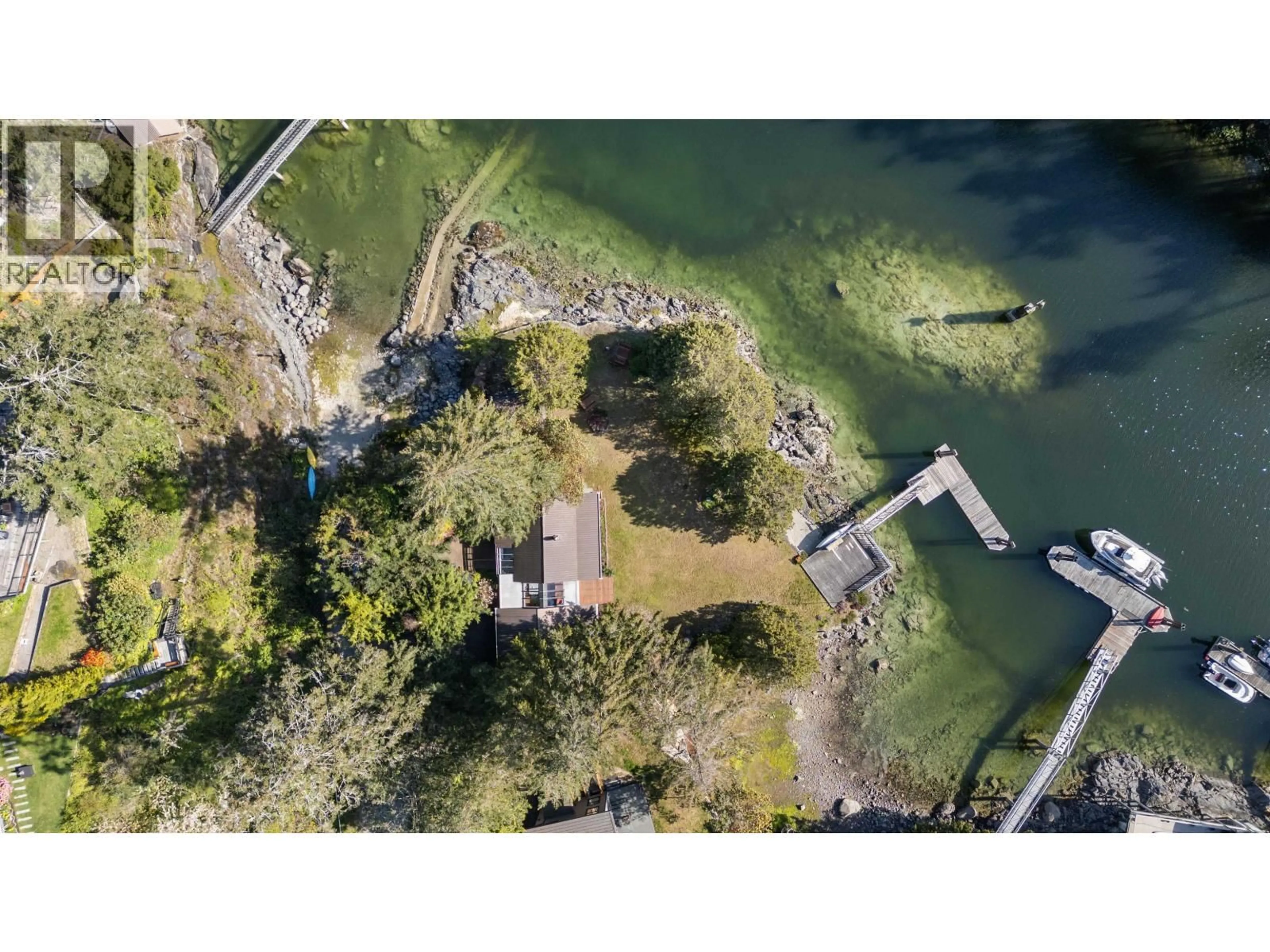 A pic from outside/outdoor area/front of a property/back of a property/a pic from drone, water/lake/river/ocean view for 5400 SANS SOUCI ROAD, Halfmoon Bay British Columbia V7Z1B6