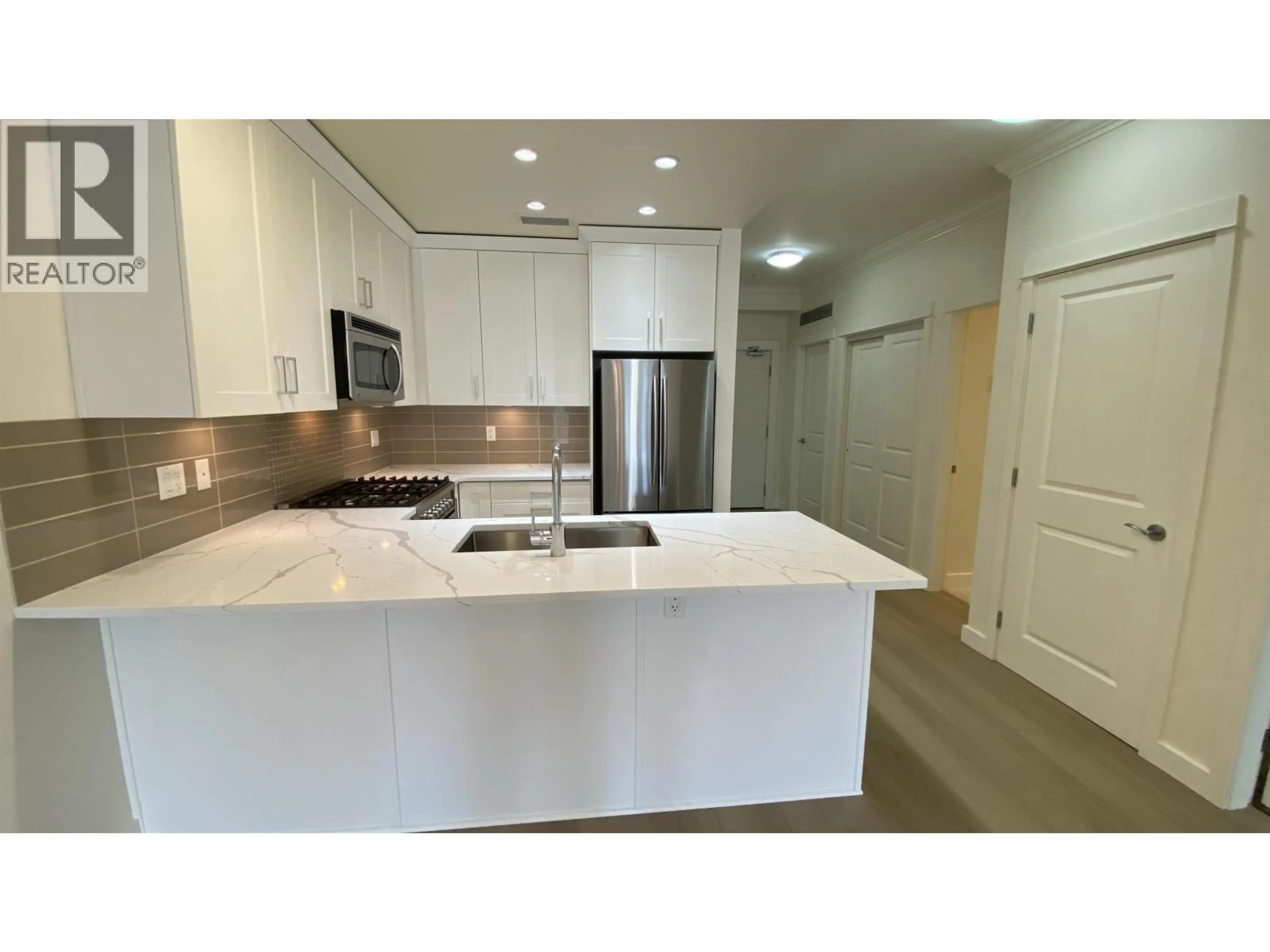 Open concept kitchen, ceramic/tile floor for 101 - 5099 SPRINGS BLVD. BOULEVARD, Delta British Columbia V4M0A2