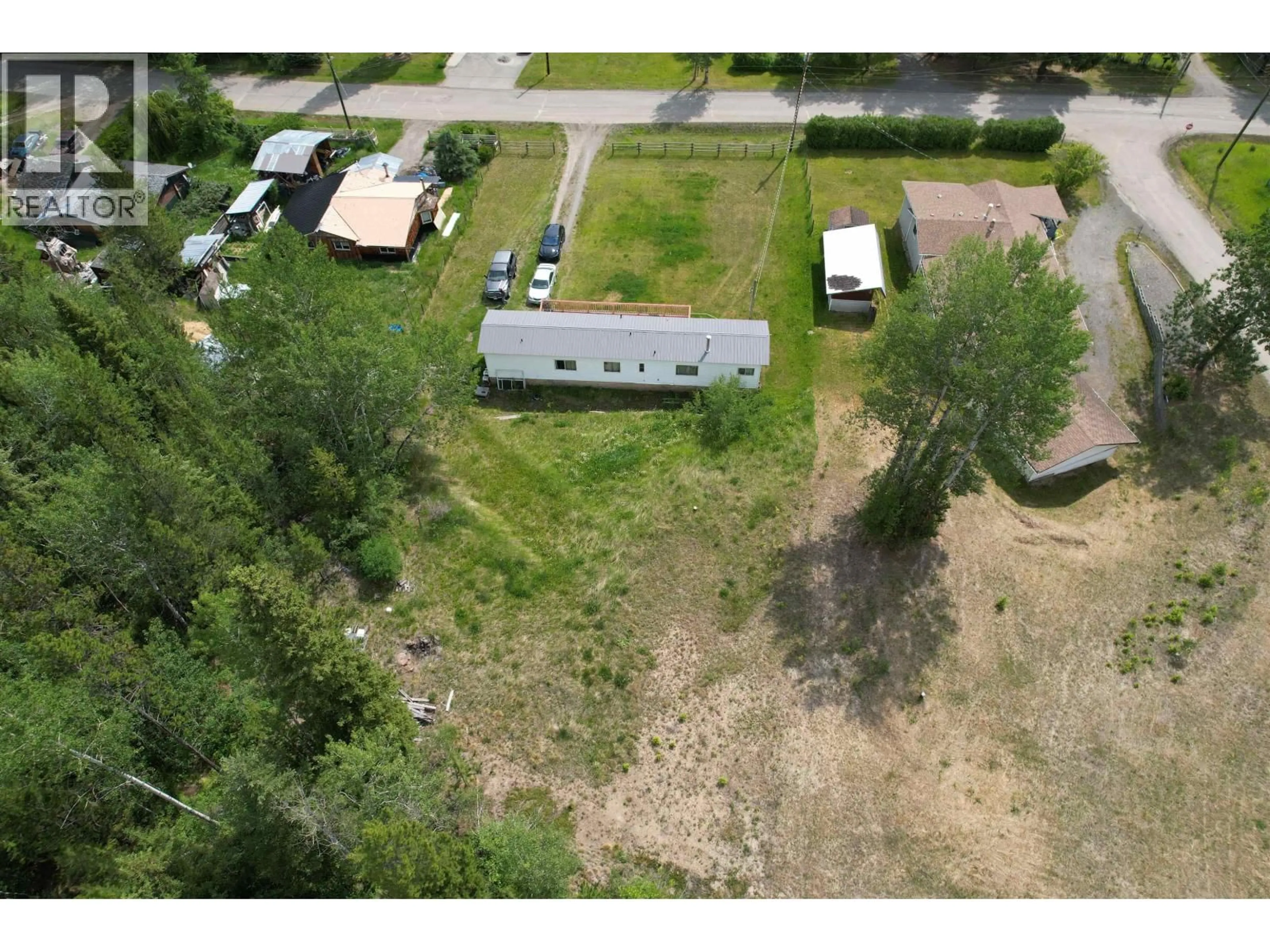 A pic from outside/outdoor area/front of a property/back of a property/a pic from drone, unknown for 5450 KENNEDY ROAD, 100 Mile House British Columbia V0K2E1