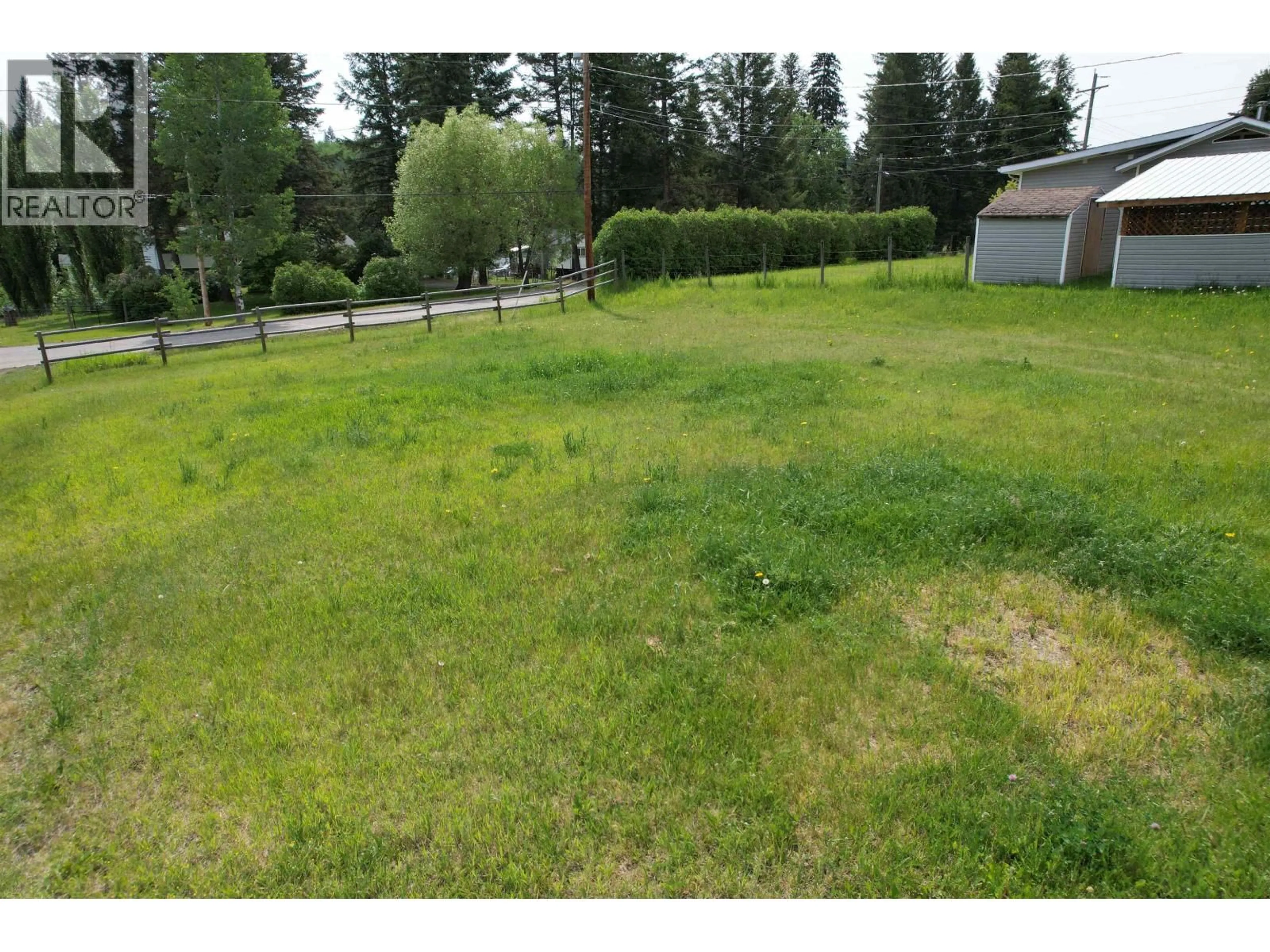 A pic from outside/outdoor area/front of a property/back of a property/a pic from drone, street for 5450 KENNEDY ROAD, 100 Mile House British Columbia V0K2E1