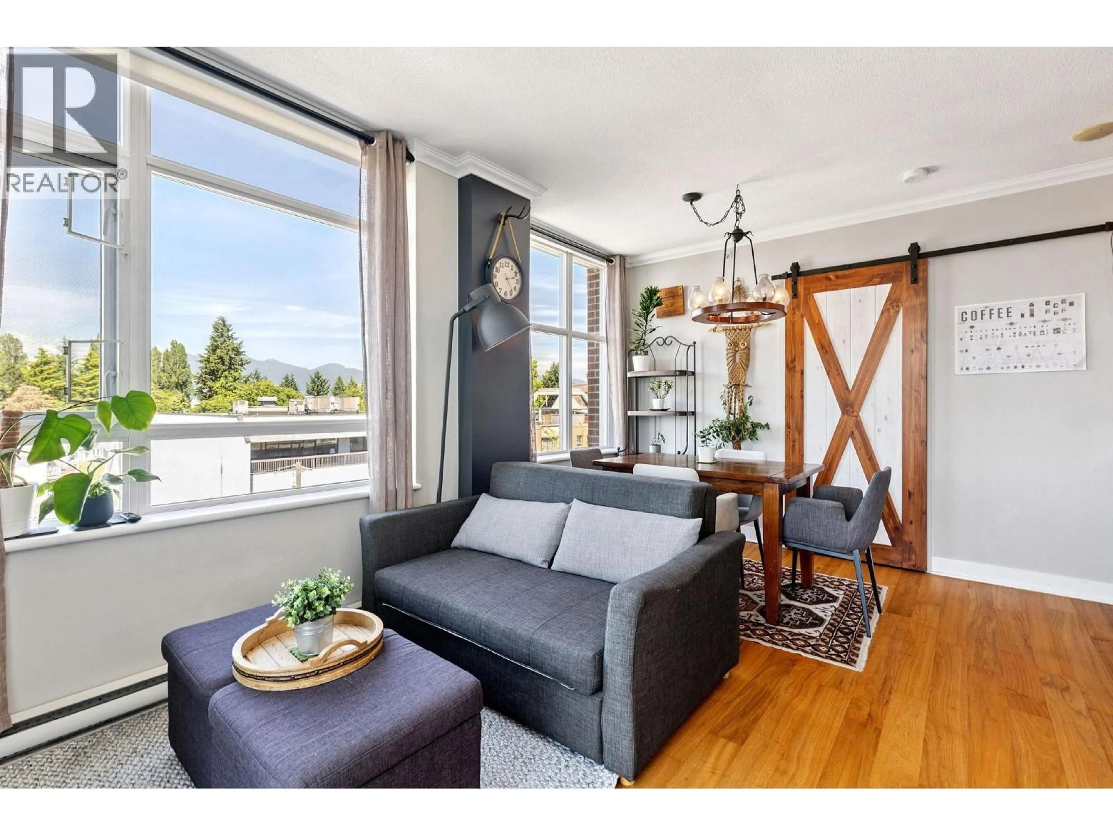 Living room with furniture, wood/laminate floor for 619 - 2268 BROADWAY, Vancouver British Columbia V6K0B2