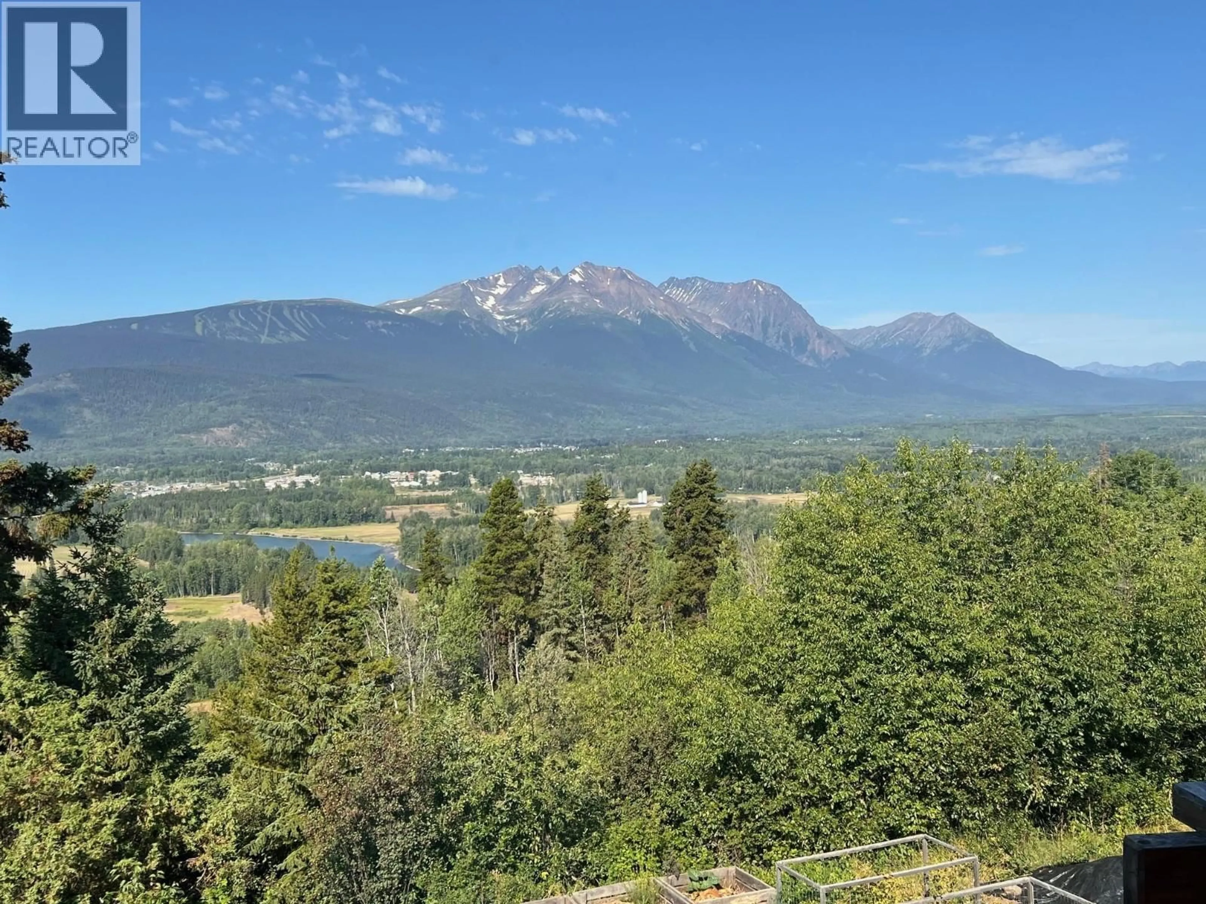 A pic from outside/outdoor area/front of a property/back of a property/a pic from drone, mountain view for 3272 MILLAR ROAD, Smithers British Columbia V0J2N6
