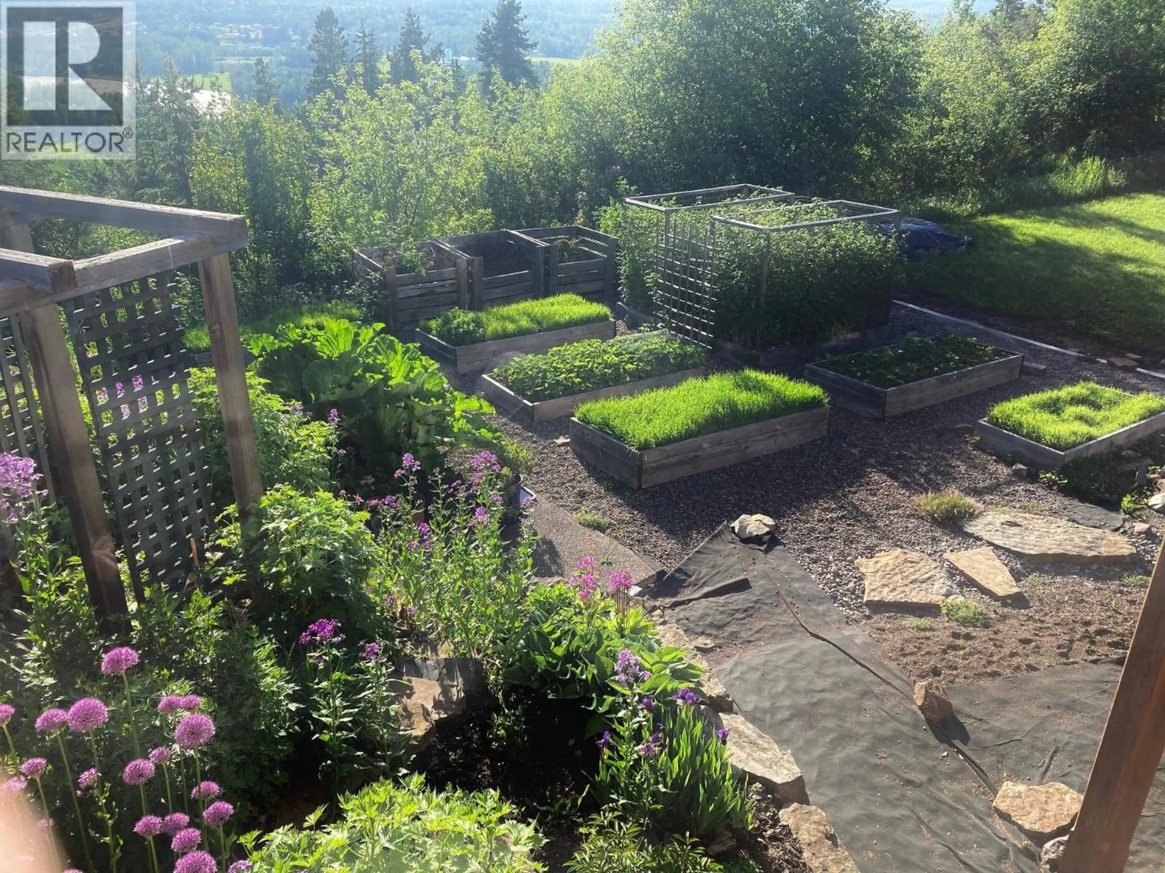 A pic from outside/outdoor area/front of a property/back of a property/a pic from drone, mountain view for 3272 MILLAR ROAD, Smithers British Columbia V0J2N6