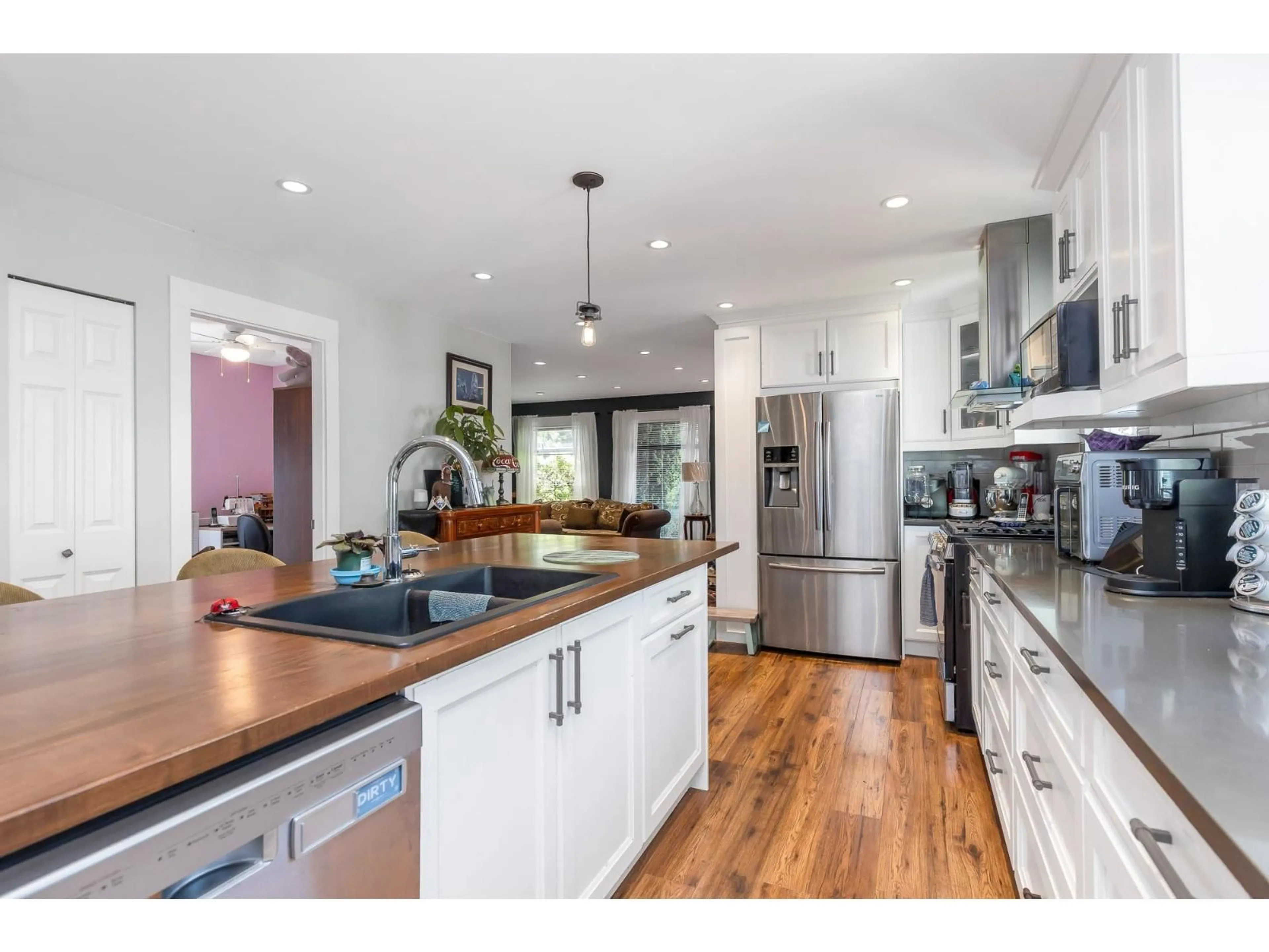 Open concept kitchen, wood/laminate floor for 5262 209, Langley British Columbia V3A6E9