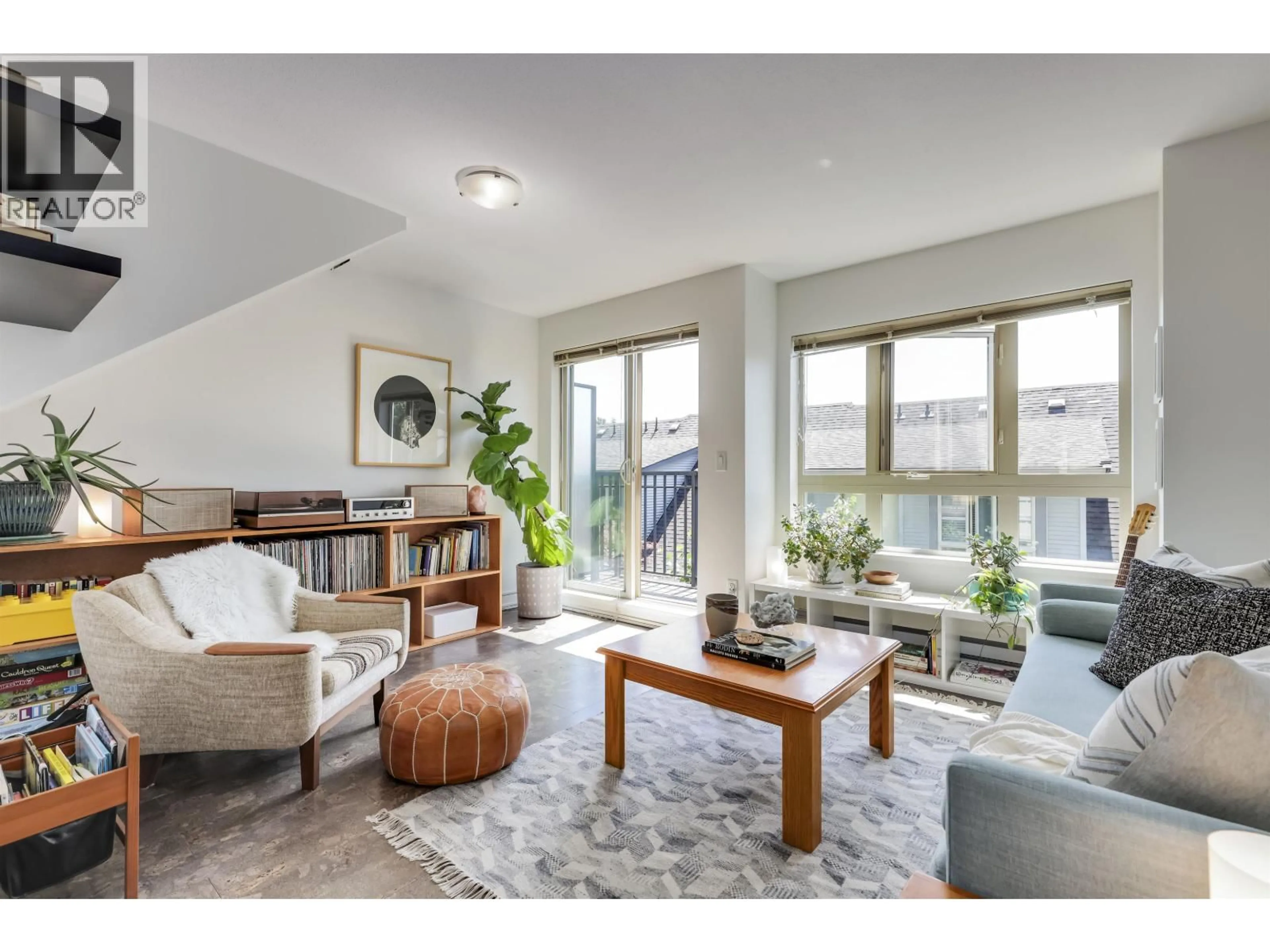 Living room with furniture, unknown for 23 - 4055 PENDER STREET, Burnaby British Columbia V5C2L9