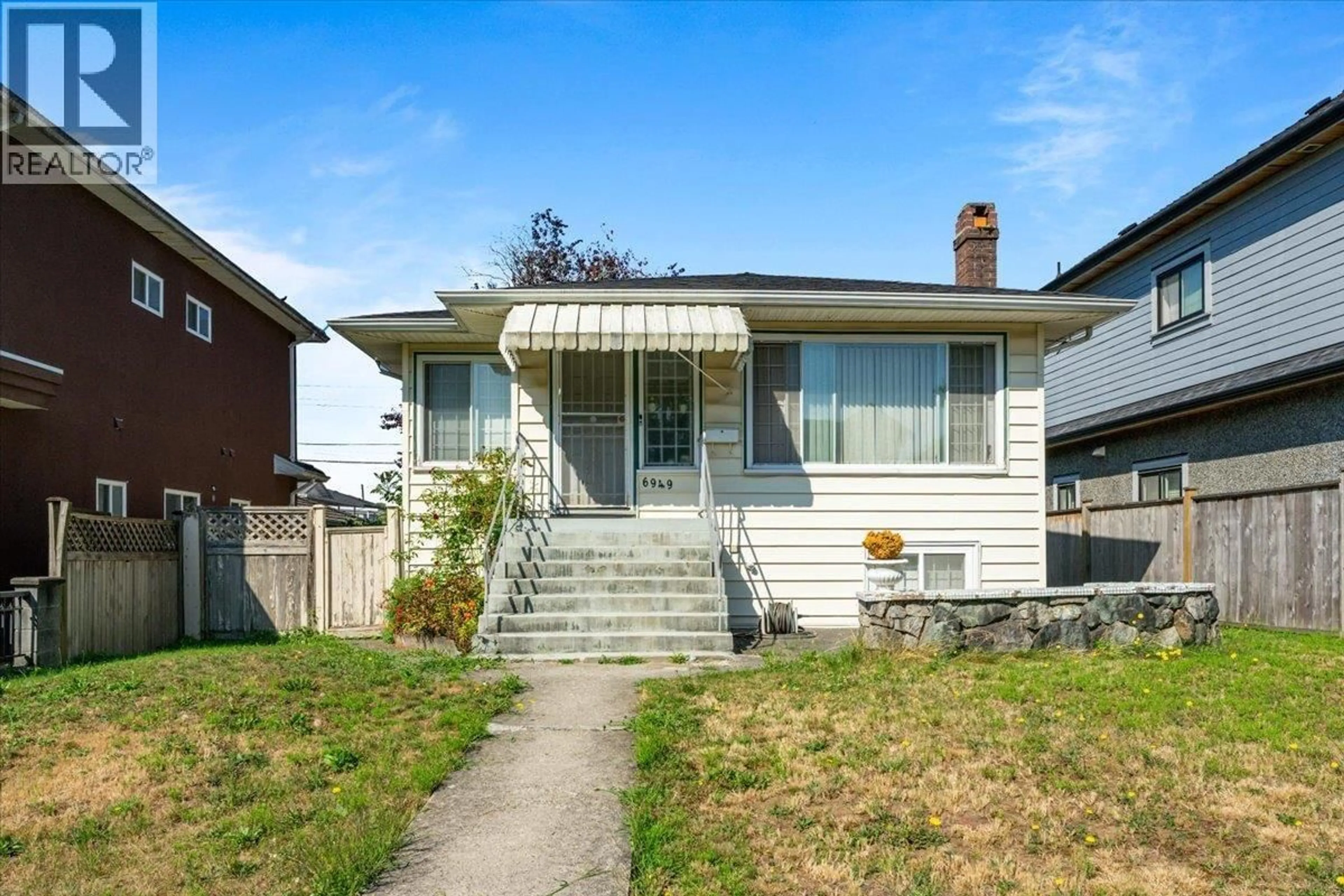 Home with vinyl exterior material, street for 6949 MCKINNON STREET, Vancouver British Columbia V5S3G4