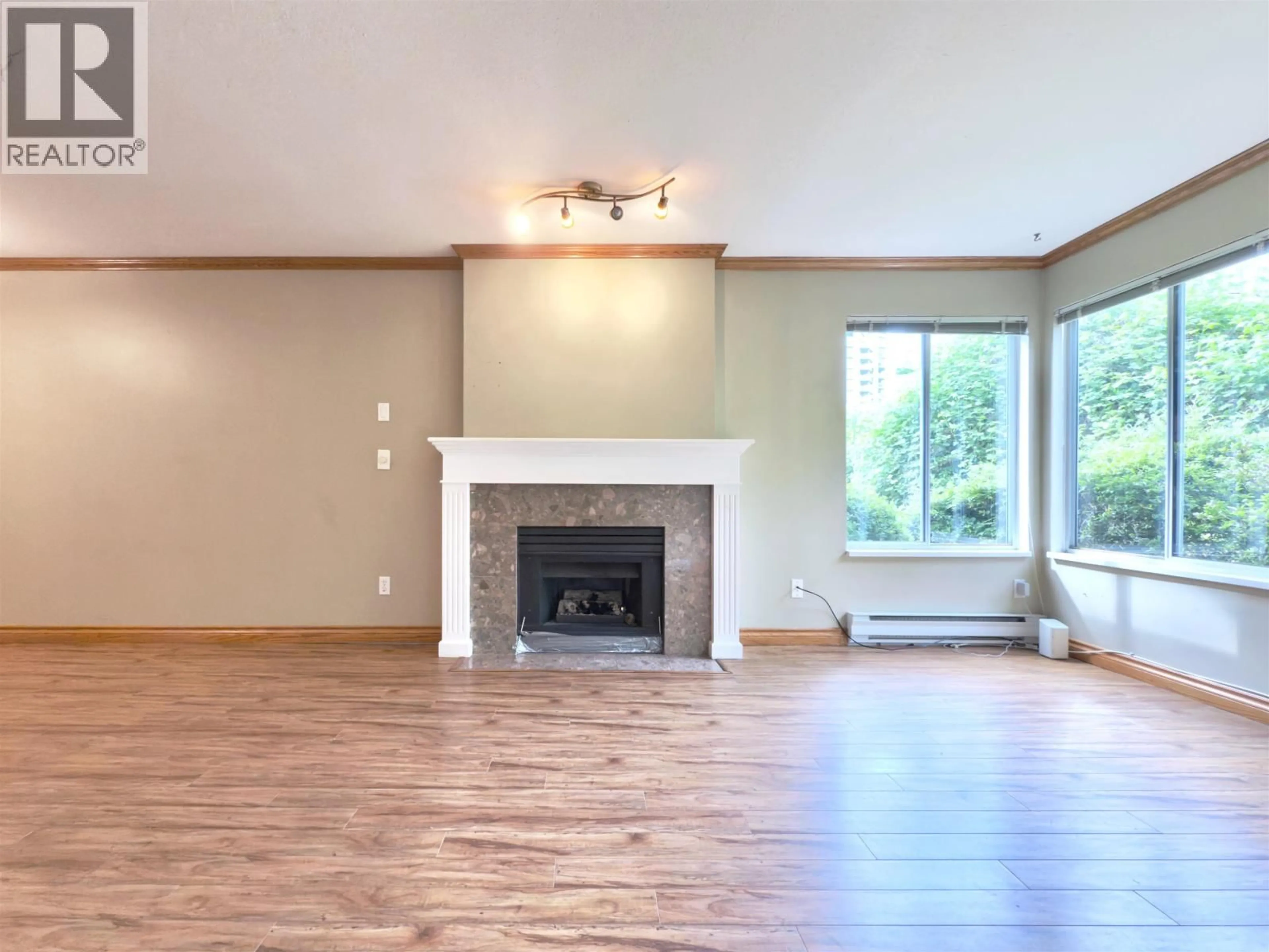 Living room with furniture, wood/laminate floor for 101 - 1171 PIPELINE ROAD, Coquitlam British Columbia V3B4R9