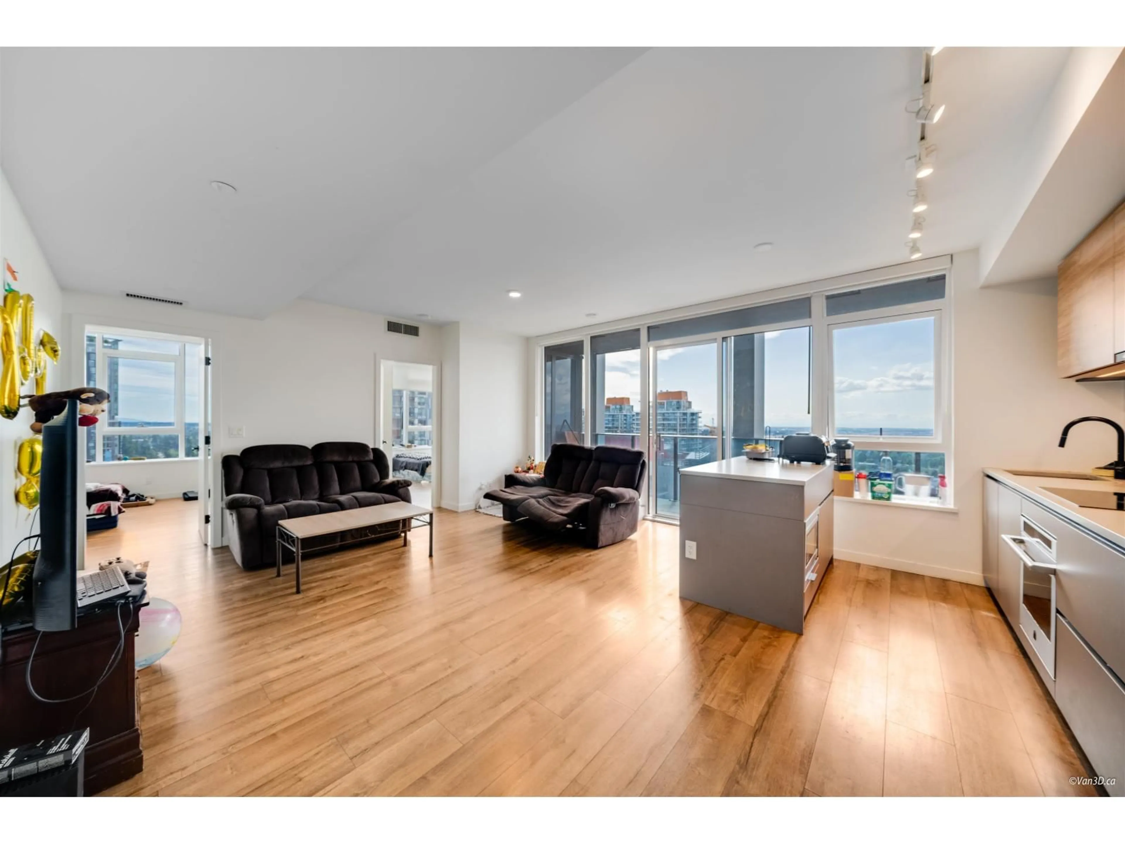 Living room with furniture, wood/laminate floor for 2710 - 10448 UNIVERSITY, Surrey British Columbia V3T0S7