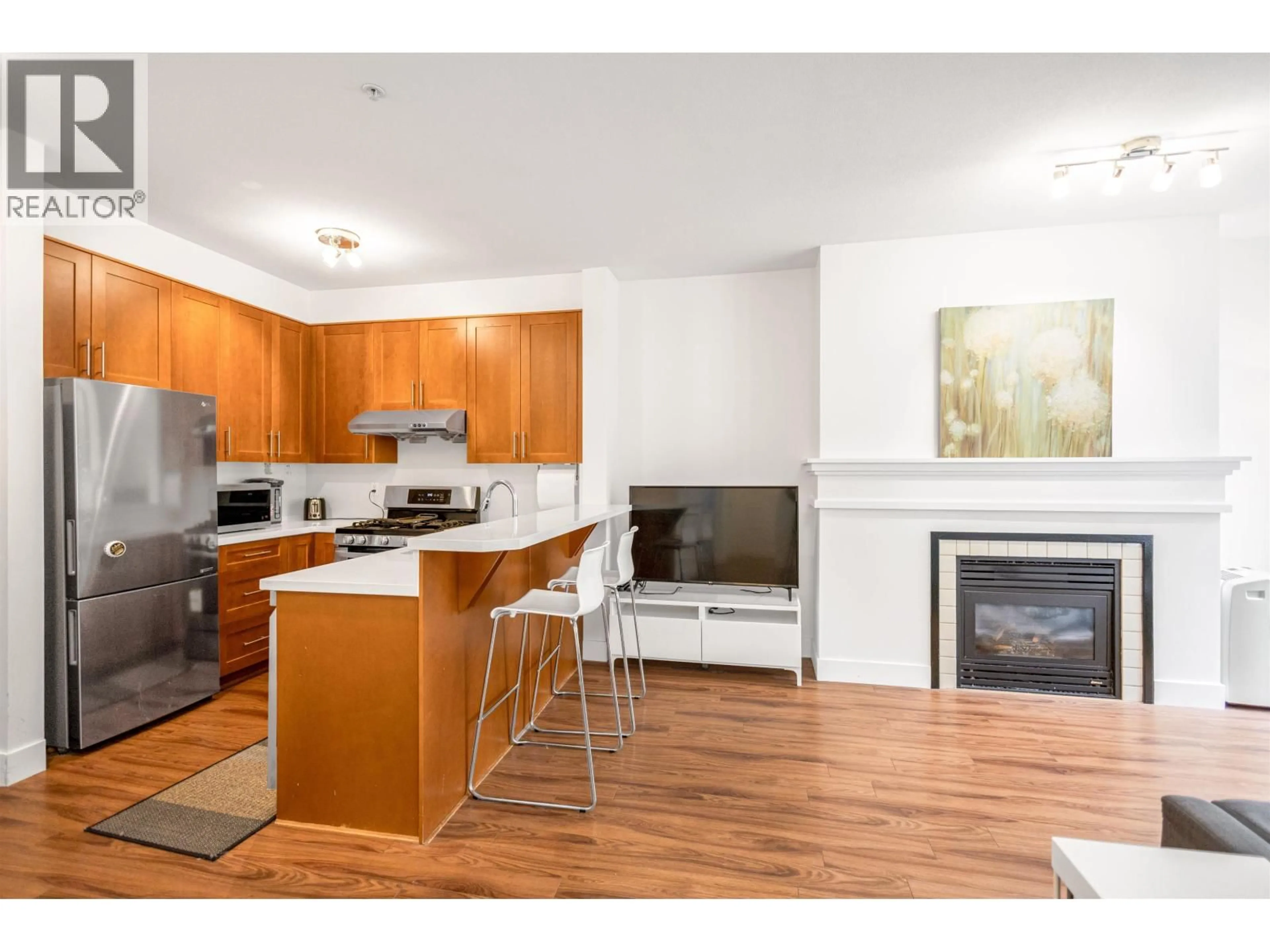 Open concept kitchen, wood/laminate floor for 1305 - 4655 VALLEY DRIVE, Vancouver British Columbia V6J5L6