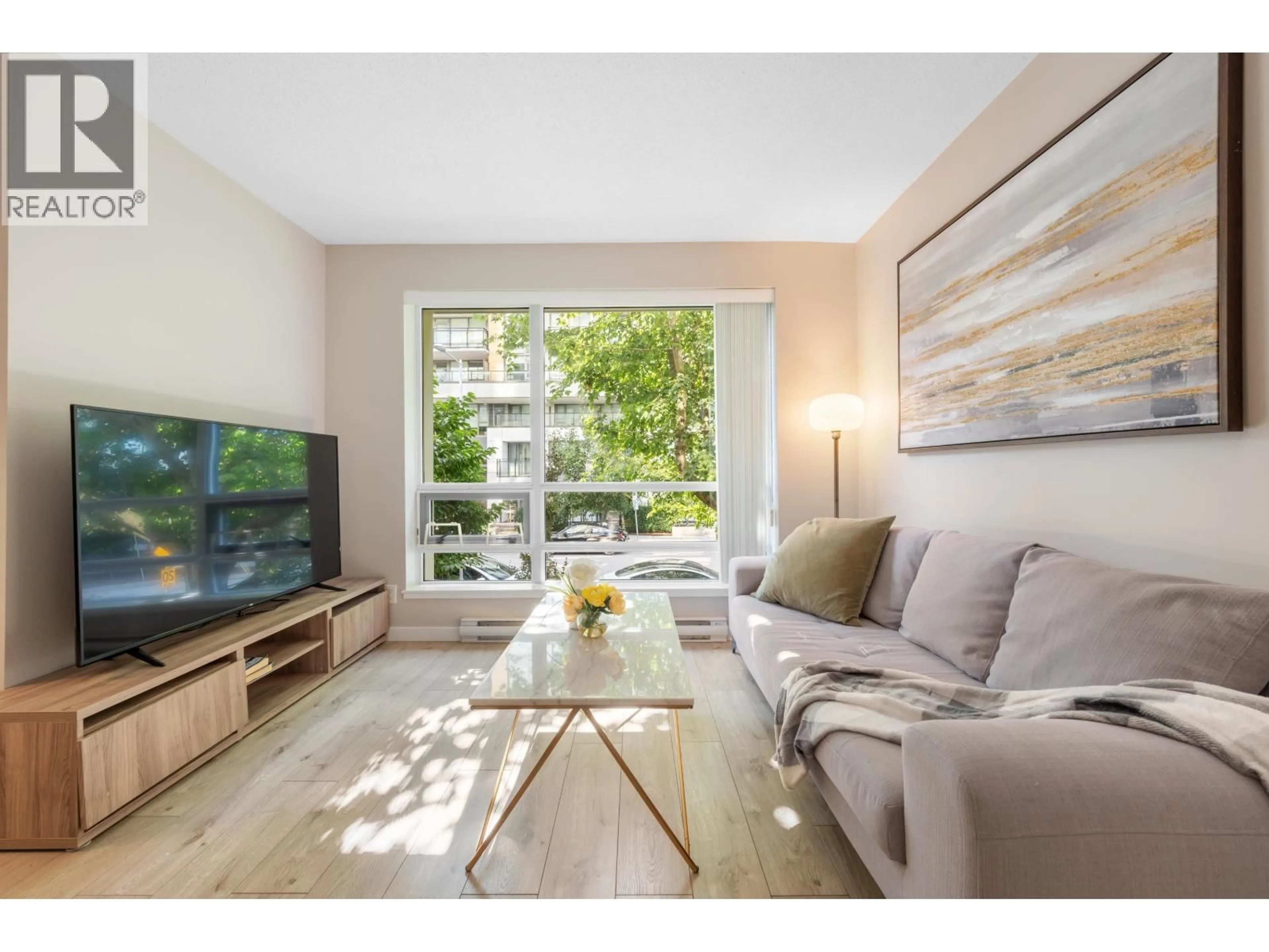Living room with furniture, wood/laminate floor for 202 - 3111 CORVETTE WAY, Richmond British Columbia V6X4K3