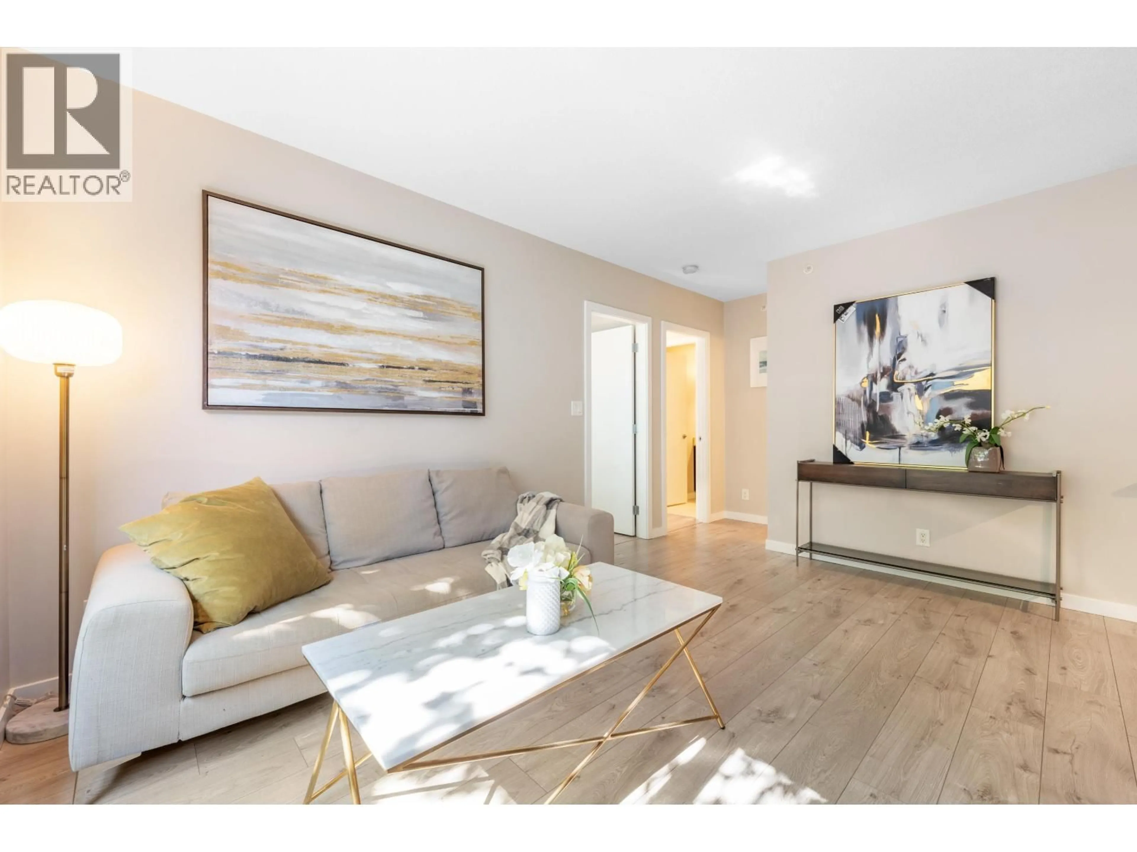 Living room with furniture, wood/laminate floor for 202 - 3111 CORVETTE WAY, Richmond British Columbia V6X4K3